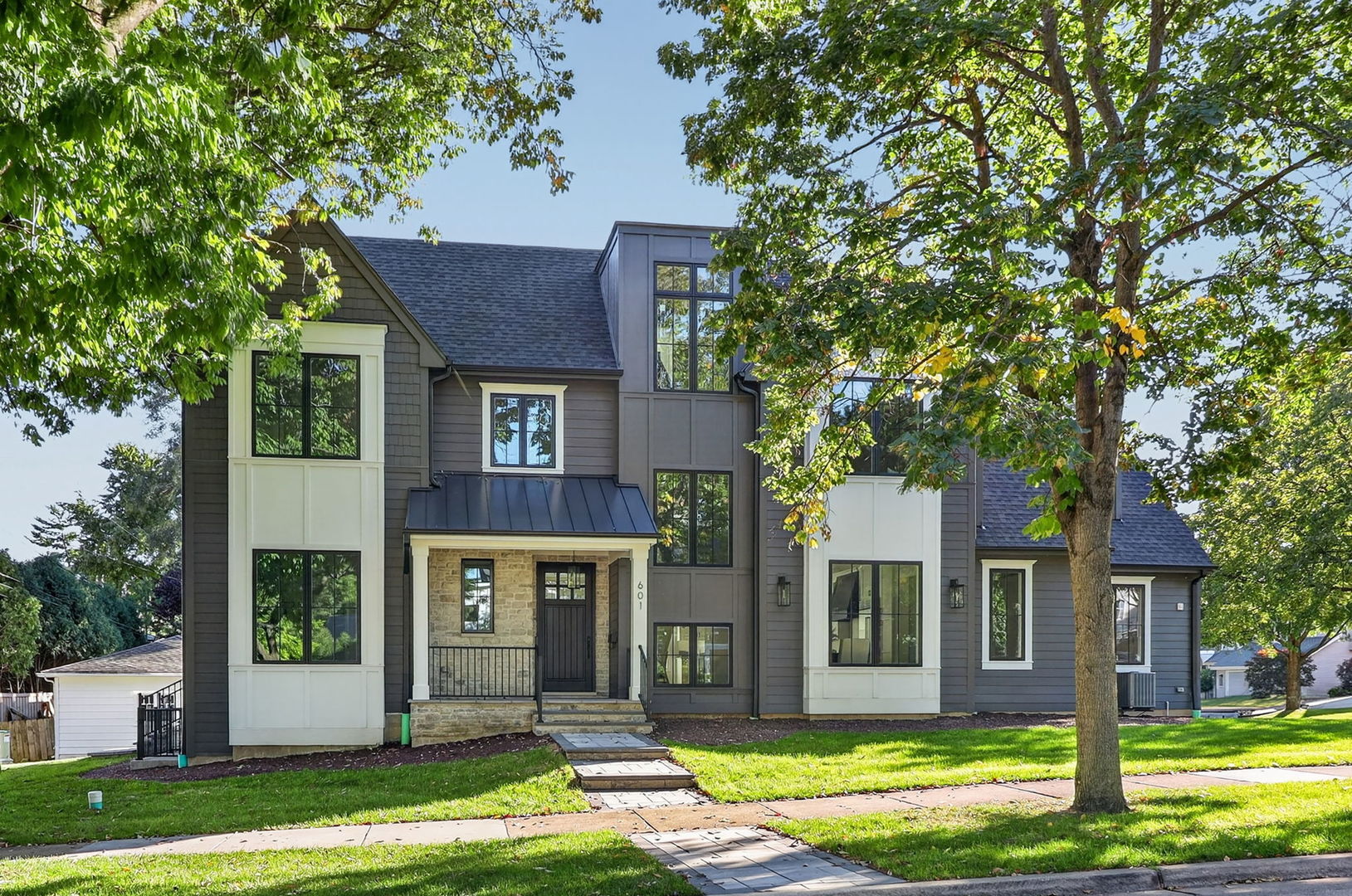 New construction like none other! This exceptional new offering from Hinsdale View Builders showcases the quality, craftsmanship, and attention to detail they have become known for throughout Hinsdale. With a reputation for excellence and a commitment to being readily accessible to homeowners, the builder has created a home designed for both today's lifestyle and tomorrow's needs.    Located in the desirable Madison School area and close to Hinsdale Central High School, this stunning home features the open-concept floor plan today's buyers are seeking. The spacious first floor flows seamlessly from room to room, while the finished lower level continues the open, inviting design. At the heart of the home is the expansive kitchen, destined to be the gathering place for family and friends, with plenty of space for everyday living and entertaining.    A private first-floor office provides the perfect quiet retreat for working from home. The luxurious primary suite features a vaulted ceiling, generous proportions, an ultra-luxurious bath, and a large walk-in closet. In addition to four spacious second-floor bedrooms, the home offers bedroom suites on both the third floor and lower level, providing exceptional flexibility for guests, family, au pairs, or extended living arrangements.    There truly is nothing missing from this extraordinary home-it offers the space, luxury, design, and amenities today's buyers desire. Now, all it needs is a new owner to make it their own... and that could be YOU!