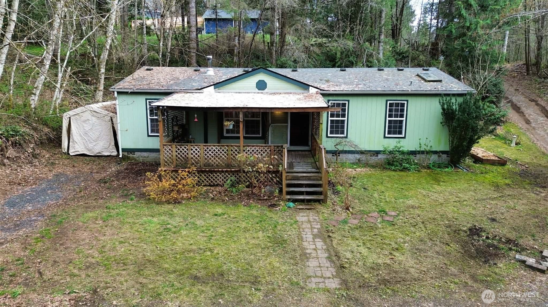 Don’t miss this incredible investment opportunity! This 1994 manufactured home offers 2 bedrooms + den, 2 bathrooms, and 1,188 square feet of comfortable living space, all set on a beautiful property just shy of one acre.Enjoy outdoor living on the spacious covered deck, perfect for relaxing and taking in the peaceful surroundings. The property features partial fencing, a garden area, and an abundance of fruit trees, including apple, plum, fig, blueberry bushes, and rhubarb—ideal for anyone looking to embrace a more self-sufficient lifestyle.Inside, you’ll find a bright living room with vaulted ceilings, a spacious kitchen with a cozy dinette area, and a split-bedroom floor plan for added privacy. The primary suite includes a large attached bathroom, creating a comfortable retreat.Listen to the soothing sounds of the nearby creek while enjoying the quiet, country feel—yet still benefiting from a convenient location close to town.Bring your animals—chickens, goats, rabbits, and pets are all welcome here! Home being sold "AS IS"