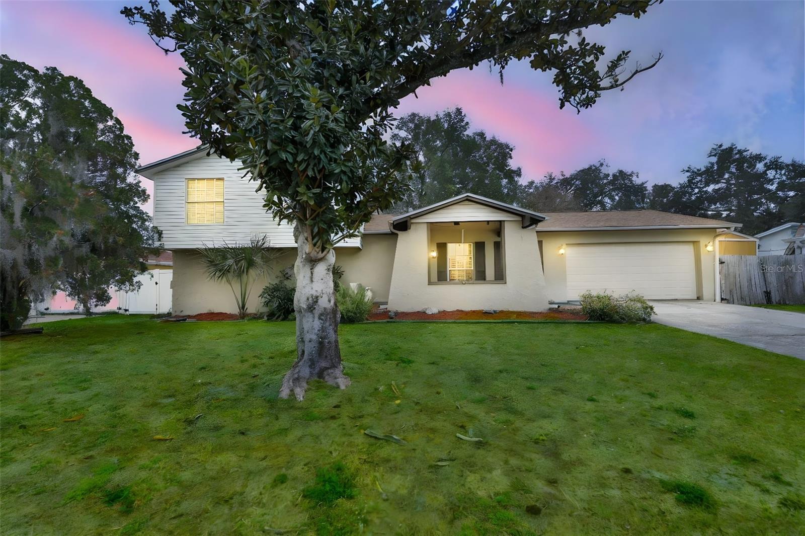 Welcome to this spacious and versatile 4-bedroom, 3-bathroom tri-level home offering a flexible layout with room to grow. The main living area features a living room, dining room, and kitchen, creating a comfortable flow for everyday living and entertaining. The lower level includes a family room along with a private bedroom and full bath, making it an ideal setup for an excellent potential mother-in-law suite, guest space, or private retreat. Upstairs, the primary suite provides a peaceful escape with a walk-in closet and en-suite bathroom, accompanied by two additional well-sized bedrooms and a full bath. Outside, enjoy a large, fully fenced backyard with a deck—perfect for outdoor dining, play, or relaxing. A 2-car garage and ample storage complete the home. The cooktop, tankless water heater, and dryer are powered by propane (property has two 100lb tanks, as well as three 50lb tanks). This property presents a great opportunity for buyers to add their personal touches while enjoying a layout that supports a variety of lifestyles.