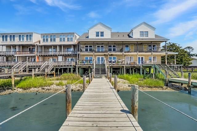 Spectacular Waterfront 5 Bedroom, 4.5 Bathroom home w/ sweeping views of the lighthouse & the  Assateague Channel. Enjoy THE BEST Flounder fishing & crabbing on the island off the renovated 60' dock (w/ deep water @ 22') or entertain friends & family in this expansive well appointed home. 1st floor Bedroom, Double kitchen, multiple decks: there is truly a place for everyone to spread out.  Enjoy the fresh ocean breezes or watch the Pony Swim from the 1st & 2nd floor decks! The house is built to withstand hurricane-force winds.  All floors are double ” plywood. 2”x6” stud walls w/ plywood inside & out w/ 1.25” of sheetrock on the inside.  Pilings are oversized & in excellent shape. Several Improvements: New Roof-2022. All 3 Heat Pumps Replaced-2024. Cooktop & Double oven-2023.  COME SEE!
