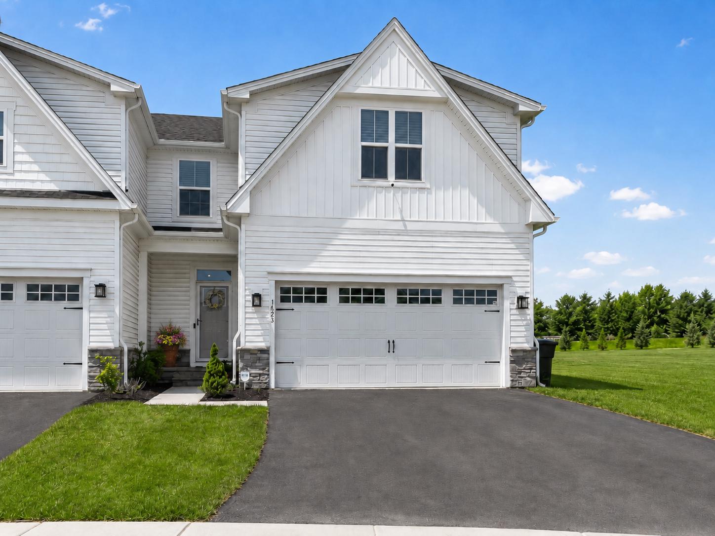 Welcome to Brandywine Walk, a sought-after 55+ community in Downingtown! This exceptional Caroline end unit model offers the perfect blend of space, style, and low-maintenance living—larger than some single-family homes and loaded with $100K+ in thoughtful upgrades. The gourmet kitchen is a showstopper with solid wood, soft-close cabinetry, quartz countertops, upgraded pendant lighting, extra-large island, and Samsung appliances, all flowing into the dining and family room with luxury vinyl plank flooring, high-hats, custom dimmers, and a cozy Dimplex electric fireplace. Enjoy main-level living with a luxurious owner’s suite featuring a tray ceiling, walk-in closet, and Roman tile shower.   The main level also houses the laundry, powder room for guests and two large storage closets. Head upstairs for two spacious bedrooms, a full tile bath, and a finished den that makes working from home a breeze. The finished basement expands your living space with a huge recreation room, extra bedroom, full bath, workshop, utility upgrades, and hardwired data outlets. Set on a premium lot backing to open space, unwind on your 12x12 Trex deck with western exposure.  Additional highlights include EV charging, 2-zone HVAC, garage storage, and countless custom touches throughout—this one truly has it all! No need to wait for building new construction when this beauty is available now.