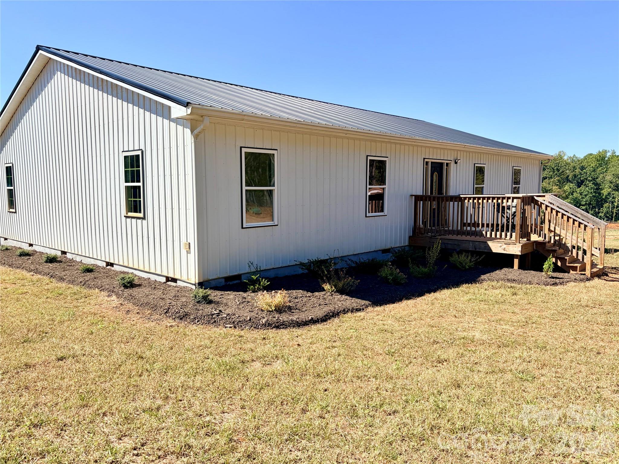 Adorable 2,400 SF contemporary farmhouse on ±15.96 acres of unrestricted land with pond and creek. Home completed in 2024 features an open floor plan, sliding barn doors, large mud/laundry room with sink, kitchen with double farmhouse sink, oversized primary suite with dual walk-in closets. Primary bath includes a large walk-in shower and is stubbed in for a future garden tub.A charming ±1,500 SF barn with old-wood facia and new barn doors. Property is currently operated as a cattle farm and is ideal for horses, livestock, or agricultural use. No zoning restrictions allow residential, agricultural, or commercial flexibility.Infrastructure includes new 2024 well and septic. The acreage offers privacy, usability, and long-term development potential in a supply-constrained Western NC market.Completed in 2024, the structure delivers modern construction, efficient systems, and immediate usability. The building features open, adaptable interior space with ample parking.