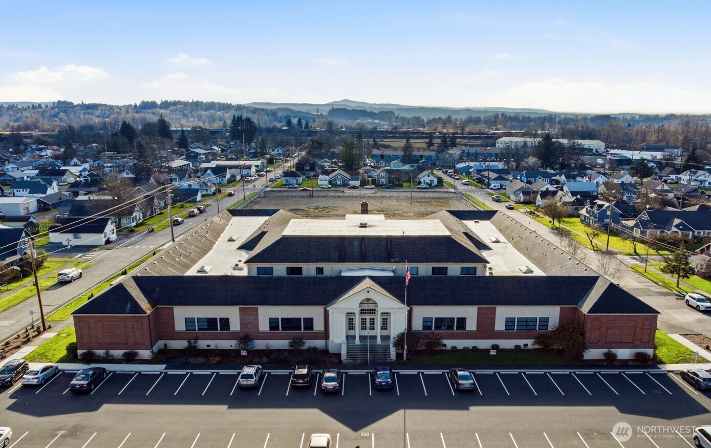Cascade School Apartments is a 51-unit historic adaptive-reuse multifamily community originally built in 1922 and thoughtfully redeveloped through 2024–2025, blending timeless architecture with modern residential upgrades. Designed by Tacoma-based firm Hill, Mock & Griffin, the property features high ceilings, expansive windows, and durable construction that create a distinctive living environment rarely found in today’s market. Supported by federal historic tax credits and a property tax reduction, the asset offers an attractive basis, reduced near-term Cap Ex, and improved long-term cash flow stability. Located in the heart of downtown Chehalis along the I-5 corridor between Seattle and Portland, the property benefits from strong regional connectivity, walkable access to local amenities, and a supply-constrained market supported by ongoing downtown revitalization. With four-sided site access, dual entry points, future development potential on the 2.08-acre site, and possible expansion through additional unit development (buyer to verify), Cascade School Apartments presents a rare opportunity to acquire a stabilized, tax-advantaged historic asset with differentiated product and embedded upside.