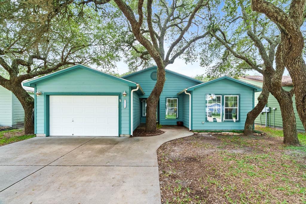 Now is your chance to own this beautifully maintained 2 bedroom, 2 bathroom home in the desirable Captain's Bay Estates! Featuring vaulted ceilings and an open concept floor plan, this home offers a spacious and inviting atmosphere perfect for everyday living and entertaining. The kitchen is the heart of the home with a large island, granite countertops, lots of cabinetry, and a seamless flow into the living and dining areas. Plantation shutters add timeless charm, while the tile flooring provides both style and easy maintenance. A versatile BONUS ROOM offers the perfect space for a home office, hobby room, or additional guest accommodations. Relax year round in the beautiful screened in patio with tile flooring, overlooking the lovely backyard. A rear gate provides access to a wooded area, and there is a community pond and walking path to enjoy as well. Additional features include a garage, spacious patio area, Lexan window panels, an electric roll down hurricane shutter for the back double doors, and a prime location just minutes from shopping, dining, the beach, and all that Rockport has to offer. Schedule your showing today and discover the easy coastal lifestyle you have been looking for!
