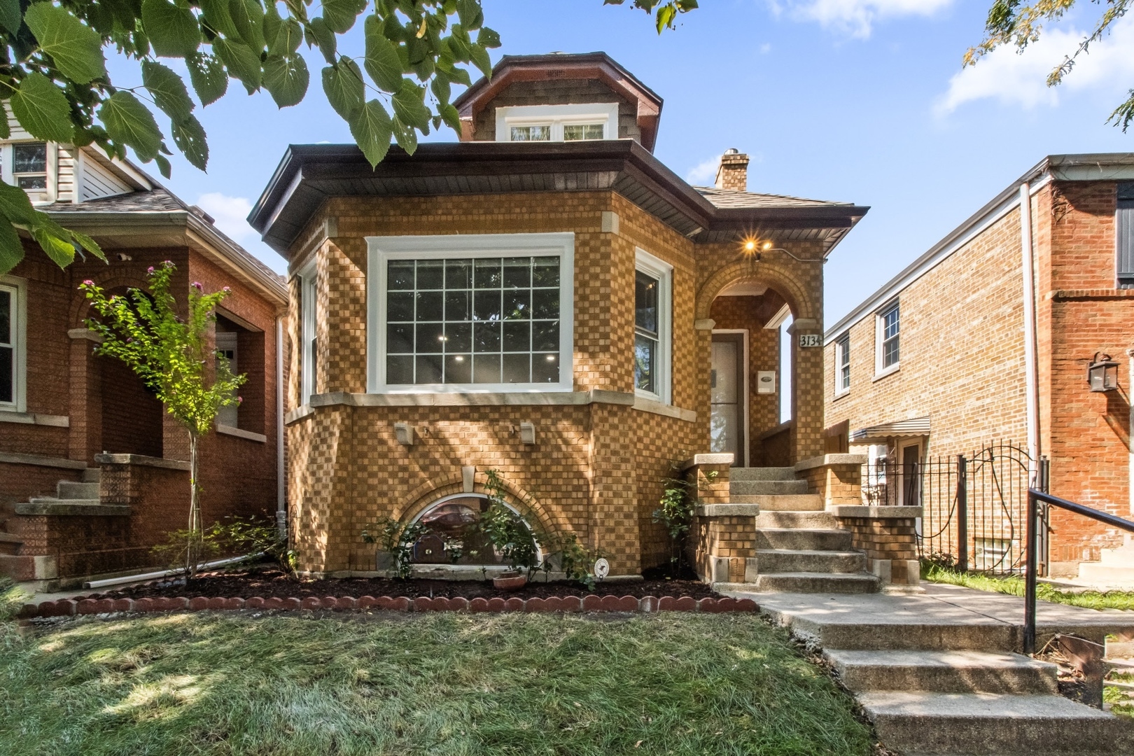 Charming brick rehabbed bungalow located in Belmont Gardens, just moments away from Avondale and Logan Square. Wide living room with huge bay window, dining area, recessed lighting, open stairway and refinished hardwood floors. Two bedrooms on main level, two on upper level and spacious sunroom off the back. Kitchen features stainless steel appliances, quartz countertops, sub tile backsplash, custom cabinets and wall-mount pot filler faucet.  Three fully updated baths including main bath suit in upper level, skylights and sitting room. Full basement currently under constructions will include large recreational room, full bath and large laundry room.  New concrete, backstair way and fencing in the backyard along with a brand new 1 car garage. Central air. Great location close to parks, shops, local restaurants, and more.