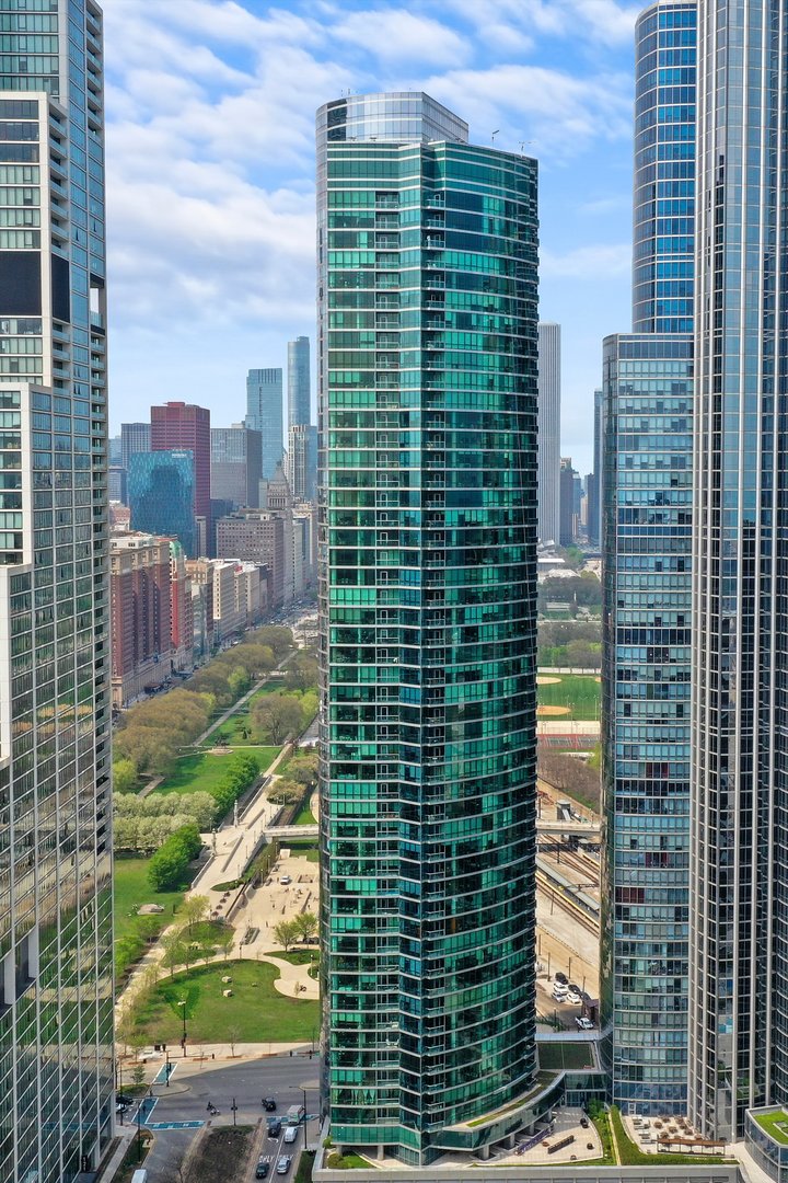 Live the Luxury Lifestyle in the "Gem" of the South Loop - One Museum Park West. This tastefully updated three-bedroom, two-bathroom unit offers everything you want and everything you need. The jaw-dropping skyline and lake views are just the beginning. The main living area is designed for entertaining, featuring separate living and dining spaces with easy access to the open kitchen. The split floor plan ensures privacy, with a spacious primary bedroom boasting a recently remodeled en-suite bath that includes double vanities, a walk-in shower, a separate soaking tub, two walk-in closets, and stunning north-facing skyline and lake views. The second and third bedrooms also showcase breathtaking views of Soldier Field, the lake, and Museum Campus.    Additional updates to this stunning unit include newer flooring throughout, completely remodeled bathrooms, and quartz countertops in the kitchen. A beautiful custom built-in entertainment center with a Sub-Zero wine fridge and a new Sub-Zero panel refrigerator elevates the space, while updated light fixtures, a private balcony, and a brand-new in-unit washer and dryer add convenience and style.    One Museum Park West is a full-amenity luxury tower, offering 24-hour door staff and concierge services, an indoor pool, a gym, a sundeck, a lounge, a catering kitchen, a children's playroom, a theater, a business center, a conference room, and even a dog bath. Located in the heart of the South Loop, this property offers easy access to Grant Park, Millennium Park, Michigan Avenue, Museum Campus, Lake Michigan, and so much more.  A tandem parking spot is available for an additional $50,000. There is also a 3rd single spot available for an additional $35,000