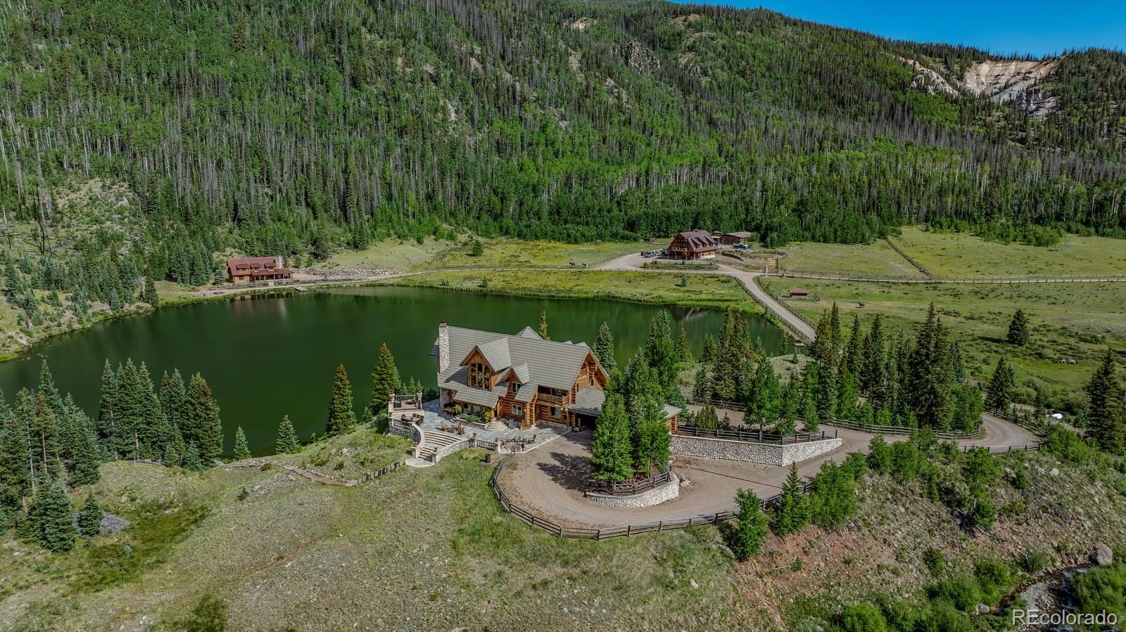 Imagine owning a secluded sanctuary where every corner of the landscape invites you to connect with the raw beauty of the San Juan Mountains. Red Mountain Ranch is just that, a 480± deeded acre one of a kind property, offering an opportunity to raw natural resources, recreational possibilities, and unmatched privacy and access.

The property features two 7±-acre lakes, over 3 miles of improved trout streams, and Red Mountain Creek, which flows through the entire length of the property. Red Mountain Creek, along with the lakes and streams, creates a private fishery that is completely under your management, offering exclusive fishing opportunities in its pristine waters. Abundant with brown trout, cutthroat trout, and rainbow trout, this fishery ensures a consistent and rewarding fishing experience while allowing owners to maintain the health and sustainability of its aquatic ecosystem.

The estate includes multiple well-appointed structures, including an Engelmann Spruce Log Cabin boasting 4,193± square feet of living space with extraordinary high ceilings, a floor-to-ceiling three-story fireplace, and expansive windows showcasing the properties breathtaking views. Additional structures on the ranch include a large barn with a caretaker’s apartment above, a second log cabin, a fully equipped workshop, and a dedicated yoga/exercise room near the main house.

Red Mountain Ranch is located in Game Management Unit 76, a highly sought-after area for big game hunting that is home to trophy-class wildlife, including 330 to 380 class bull elk and moose. The property is enrolled in the Landowner Preference Program and historically receives one bull elk tag, three cow elk tags, and one application for mule deer. This unit is truly considered one of the best Game Management Units in the region for hunting moose and elk, making it a prime location for hunters.