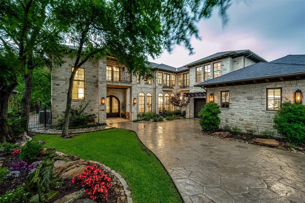 Nestled in the prestigious Shoal Creek neighborhood, this exquisite 6-bedroom, 8-bathroom transitional estate spans 8,535 square feet on a sprawling .48-acre heavily wooded lot, offering unparalleled privacy and natural beauty. Meticulously updated with timeless elegance, this home seamlessly blends classic style with modern sophistication, creating a luxurious country-in-the-city retreat. Step inside to discover a grand interior showcasing extensive updates, including rich hardwoods, custom millwork, and designer finishes throughout. The gourmet kitchen is a chef’s dream, featuring an open floor plan with built-in refrigerators, double ovens, a gas cooktop, and dual dishwashers, all framed by an oversized window with picturesque views of the lush grounds. The second level primary suite is a serene sanctuary, complete with a fireplace, private balcony access, and a spa-inspired bath boasting a jetted tub, massive shower, dual vanities, and two generous closet spaces. Designed for grand entertaining, the home offers multiple large living spaces connecting to the expansive backyard. Outdoors, the wooded lot shines with a large, heated diving pool, slide, separate spa and fire pit. A rare opportunity to own a masterfully updated estate on one of the most private lots in the area.