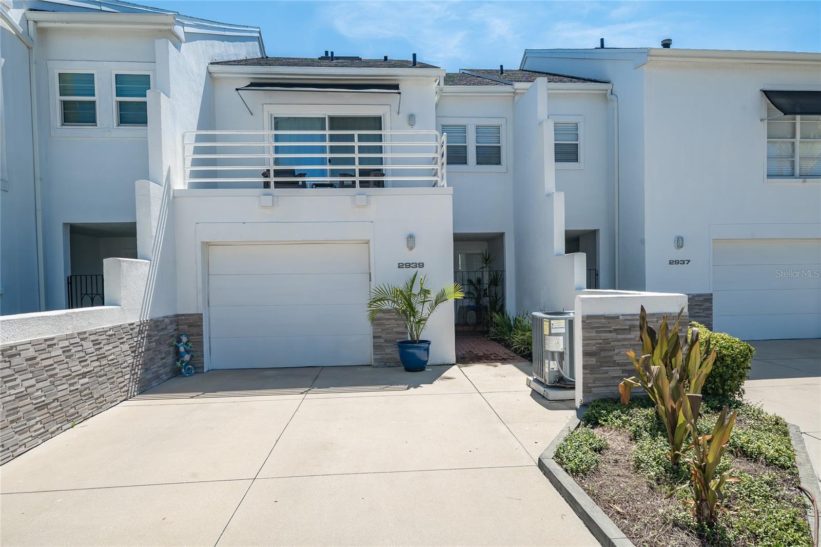 LOCATION, LOCATION, LOCATION! Just two blocks from iconic BAYSHORE BOULEVARD, this beautifully maintained South Tampa townhome offers an incredible lifestyle with walking, jogging, biking, waterfront views and spectacular sunsets right nearby. Enjoy an abundance of RESTAURANTS, SHOPPING, ENTERTAINMENT, with DOWNTOWN TAMPA only 10 MINUTES and the Lee Roy Selmon Expressway just one mile away.Major updates provide added peace of mind! The ROOF was replaced in 2026 with a BRAND-NEW-SKYLIGHT added at the same time, the AIR CONDITIONER was replaced in 2025, and the EXTERIOR is SCHEDULED to be REPAINTED.This spacious 2-bedroom, 2½-bath townhome features CROWN MOLDING throughout and NO CARPET anywhere, making it stylish and easy to maintain. The GREAT ROOM and DINING AREA feature beautiful WOOD FLOORING, while the great room offers a WOOD-BURNING FIREPLACE and an entire wall of shelving perfect for displaying books, collectibles and décor. A convenient DOWNSTAIRS HALF BATH is ideal for guests, and the great room opens to an incredible, COMPLETELY PRIVATE BACKYARD TERRACE with outdoor lighting—perfect for morning coffee, relaxing evenings or entertaining.The KITCHEN features GRANITE countertops, a PANTRY and ALL APPLIANCES, with the WASHER and DRYER also INCLUDED. UPSTAIRS, the STAIRS, HALLWAY BOTH BEDROOMS feature LAMINATE flooring, providing a seamless look, easy maintenance and no carpet to clean or replace. BOTH BEDROOMS have private EN-SUITE BATHS, each featuring modern FRAMELESS GLASS SHOWER DOORS and tile extending to the ceiling. The second-floor BALCONY OVERLOOKS the FIRST LEVEL, creating an open, airy feel, while the new skylight fills the upper level with natural light. The PRIMARY SUITE features a WALK-IN CLOSET and SLIDING DOORS leading to its own PRIVATE BALCONY.Additional conveniences include a single-car GARAGE plus DRIVEWAY parking for TWO Additional VEHICLES, a valuable feature in this highly desirable South Tampa location. Residents also enjoy access to the community pool and all the benefits of living just moments from Bayshore Boulevard.With an UNBEATABLE LOCATION, PRIVATE OUTDOOR LIVING SPACE, major RECENT UPDATES, abundant parking and stylish finishes throughout, this is the SOUTH TAMPA TOWNHOME you've been waiting for. SCHEDULE YOUR PRIVATE SHOWING TODAY BEFORE SOMEONE ELSE HAS THE OPPORTUNITY TO CALL IT HOME!