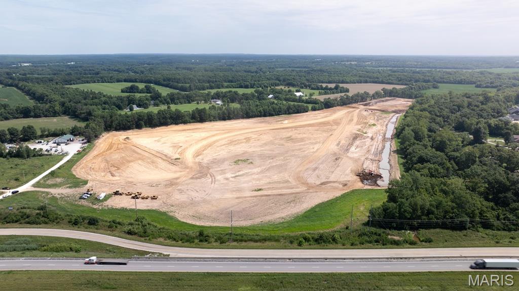 COMMERCIAL/INDUSTRIAL BUILDING SITES!! Choose your site from 36+/- ACRES OF LAND that is ready-to-build with exceptional road frontage! Price per acre varies depending on size and location. Lot lines and sizes can be adjusted to fit your needs. Located just off Highway 61, this property provides outstanding visibility, easy access to major highways, only 15 minutes from Wentzville, and 45 minutes from St. Louis International Airport. Zoned for commercial and industrial use, it’s ideally positioned near retail, restaurants, schools, and growing residential communities—making it the perfect environment to launch or expand your business in one of Missouri’s fastest-growing counties. See attachments and photos for site plan with prices. Seller will consider build-to-suit options.