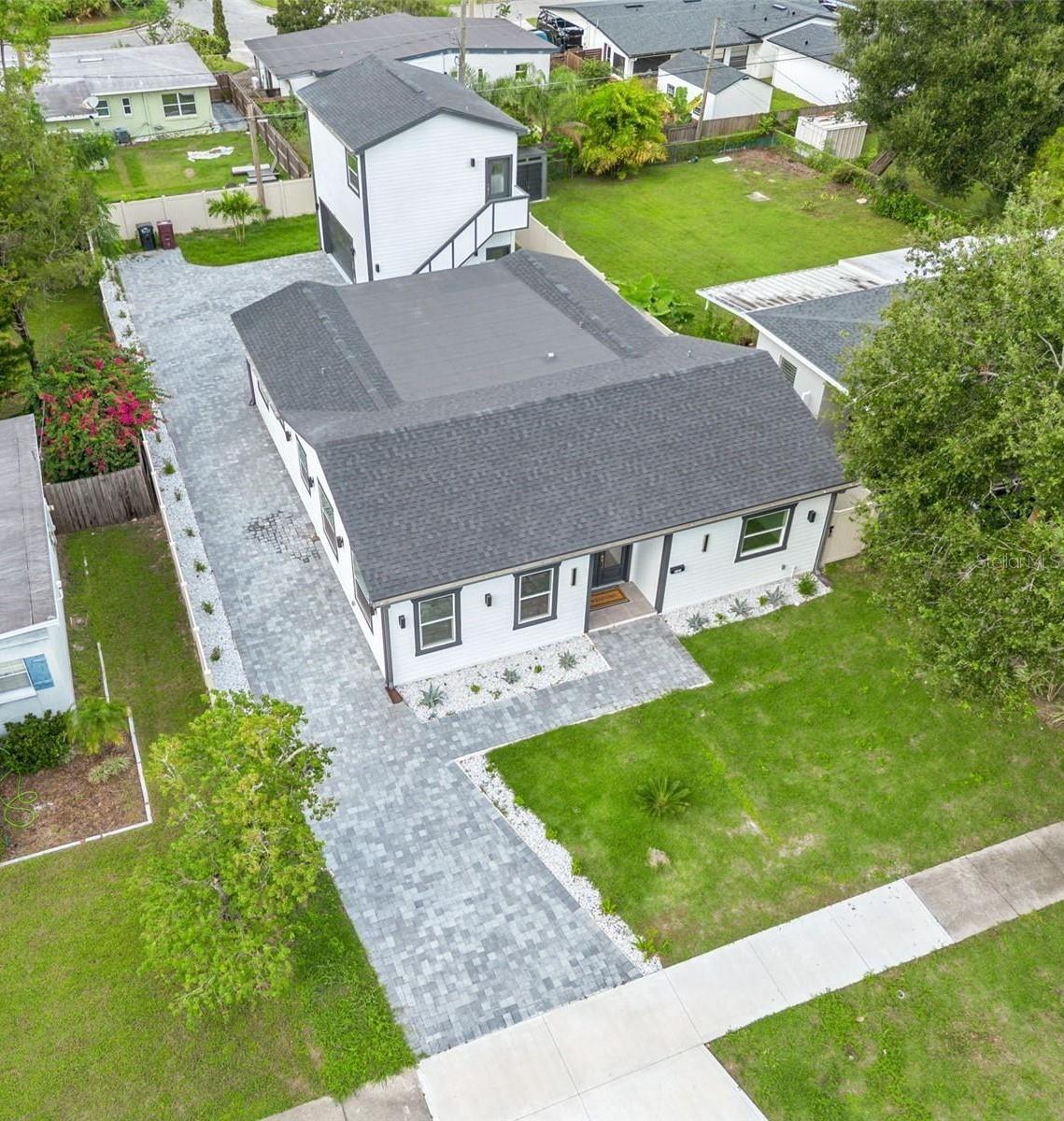 INCOME PRODUCING PROPERTY. Brand new construction meets modern elegance at 3101 Pickfair Street in Orlando, Florida a home that perfectly blends design, functionality, and investment potential. This stunning 5-bedroom, 4-bath residence built in 2025 offers approximately 2,483 square feet of beautifully designed living space, including a detached guest suite that can serve as a **multigenerational unit or a rental** to help offset your mortgage. Inside, you’ll find wood floors throughout, soaring ceilings, a gourmet kitchen with a large island and quartz countertops, and huge windows that fill every room with natural light. The open-concept layout creates a seamless flow between living, dining, and entertaining spaces, making it both sophisticated and comfortable. The exterior features a long driveway with elegant pavers, modern curb appeal, and the added benefit of **no homeowners association**, giving you freedom and flexibility.

Ideally located just 2.8 miles or about a 6-minute drive from **Lake Eola Park** and downtown Orlando, this property offers quick access to **Publix, Target, and Starbucks**, all within 1–2 miles. It’s also perfectly positioned for those who travel often or appreciate convenience, being approximately **20 minutes from Orlando International Airport** and only **10 minutes from the Orlando Executive Airport**. This central location places you near top dining, shopping, and entertainment venues, making it an excellent choice for professionals, families, or investors seeking both lifestyle and long-term value.

The detached back unit, complete with its own entrance and kitchen, provides an outstanding opportunity for extra income, guest accommodations, or multigenerational living in one of Orlando’s most desirable rental areas. With brand new construction ensuring low maintenance and peace of mind, plus a fenced yard and beautiful architectural details, **3101 Pickfair Street** is more than a home, it’s a smart investment and a lifestyle upgrade in one. Schedule your private showing today and experience a property where elegance, practicality, and profitability come together in the heart of Orlando.