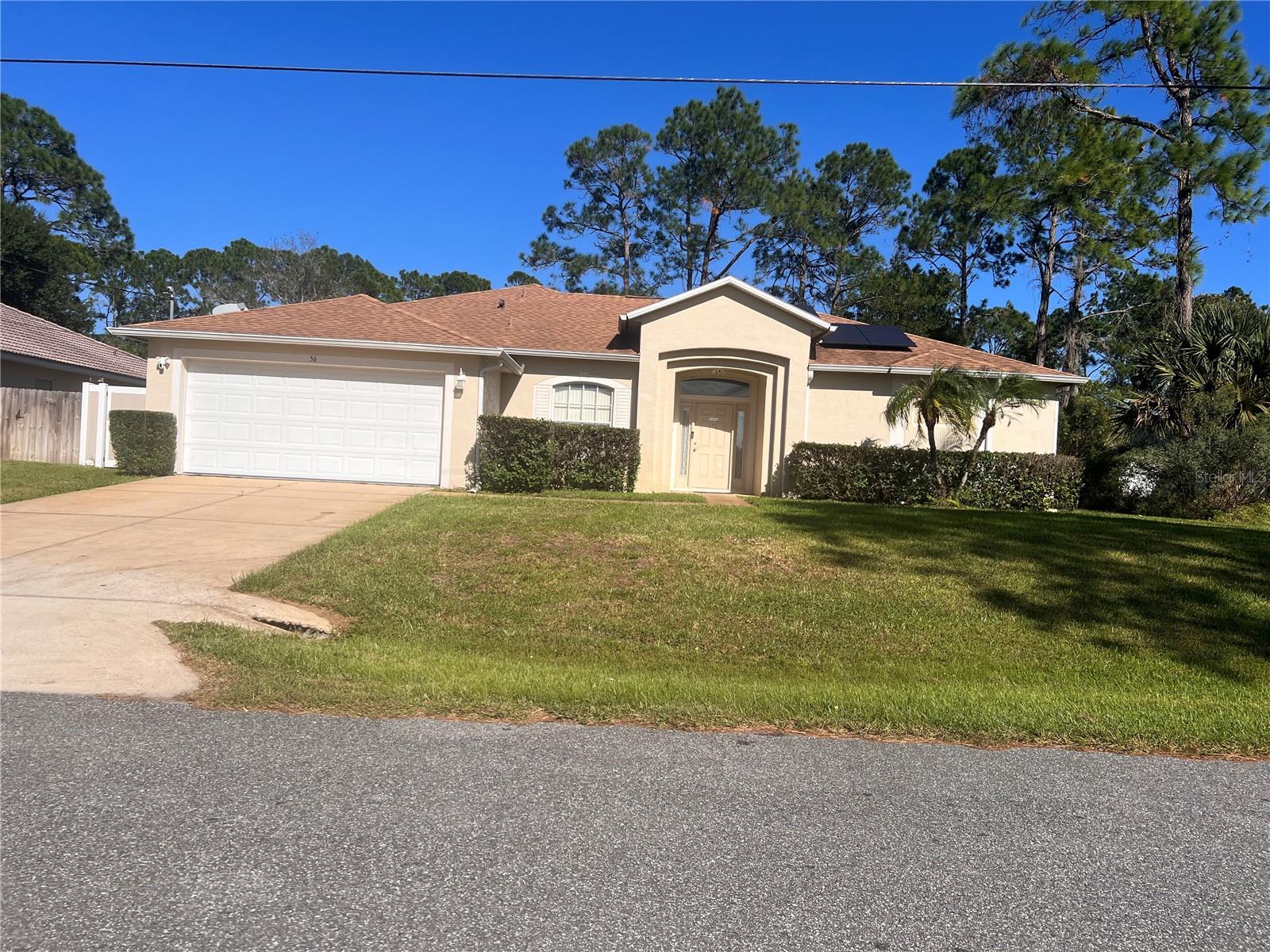 Welcome home to this beautifully maintained 3-bedroom, 2-bath residence in Palm Coast! This home offers desirable updates and features designed for comfort, convenience, and peace of mind. Enjoy the appeal of a newer roof (less than five years old), a NEW AC system installed in 2026, and a newer hot water heater. The interior features stylish luxury vinyl flooring, while the exterior boasts newer two-tone vinyl fencing enclosing the backyard—perfect for added privacy, outdoor enjoyment, and entertaining. Additional highlights include a 2026 exterior Ring security camera system with motion detection, a sprinkler system supplied by a private well, and solar panels for added energy-efficiency potential. With valuable improvements already in place, this property offers an excellent opportunity to enjoy the Palm Coast lifestyle. Schedule your private showing today and discover all this home has in store for you, your family, friends and furry friends!MOTIVATED SELLER! ANY REASONAL OFFES WILL BE CONSIDERED!(All room measurements are approximate and not guaranteed to be exact to as state.)