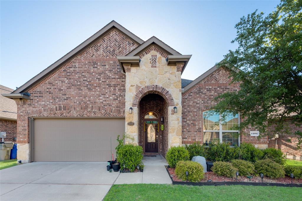 Step into comfort and style with this stunning 3-bedroom, 2-bathroom home that blends charm, space, and functionality. From the moment you arrive, the striking brick and stone exterior sets the tone for what awaits inside.

You'll love the open-concept living area, complete with vaulted tray ceilings and a cozy fireplace—perfect for relaxing or entertaining. The beautiful tile floors lead you into a chef-inspired kitchen featuring gleaming countertops, a spacious island with breakfast bar seating, a gas range, and a walk-in pantry that keeps everything organized.

Retreat to the oversized primary suite with built-in closet storage and a luxurious en suite bathroom boasting dual sinks, a relaxing corner garden tub, and a separate shower.

Enjoy outdoor living with a lush, expansive lawn ideal for weekend hangouts or a quiet evening under the stars. Conveniently located near Lewisville Lake, Hidden Cove Park, and major highways, this home has it all.

Don’t miss your chance to lease this gem—schedule your tour today!