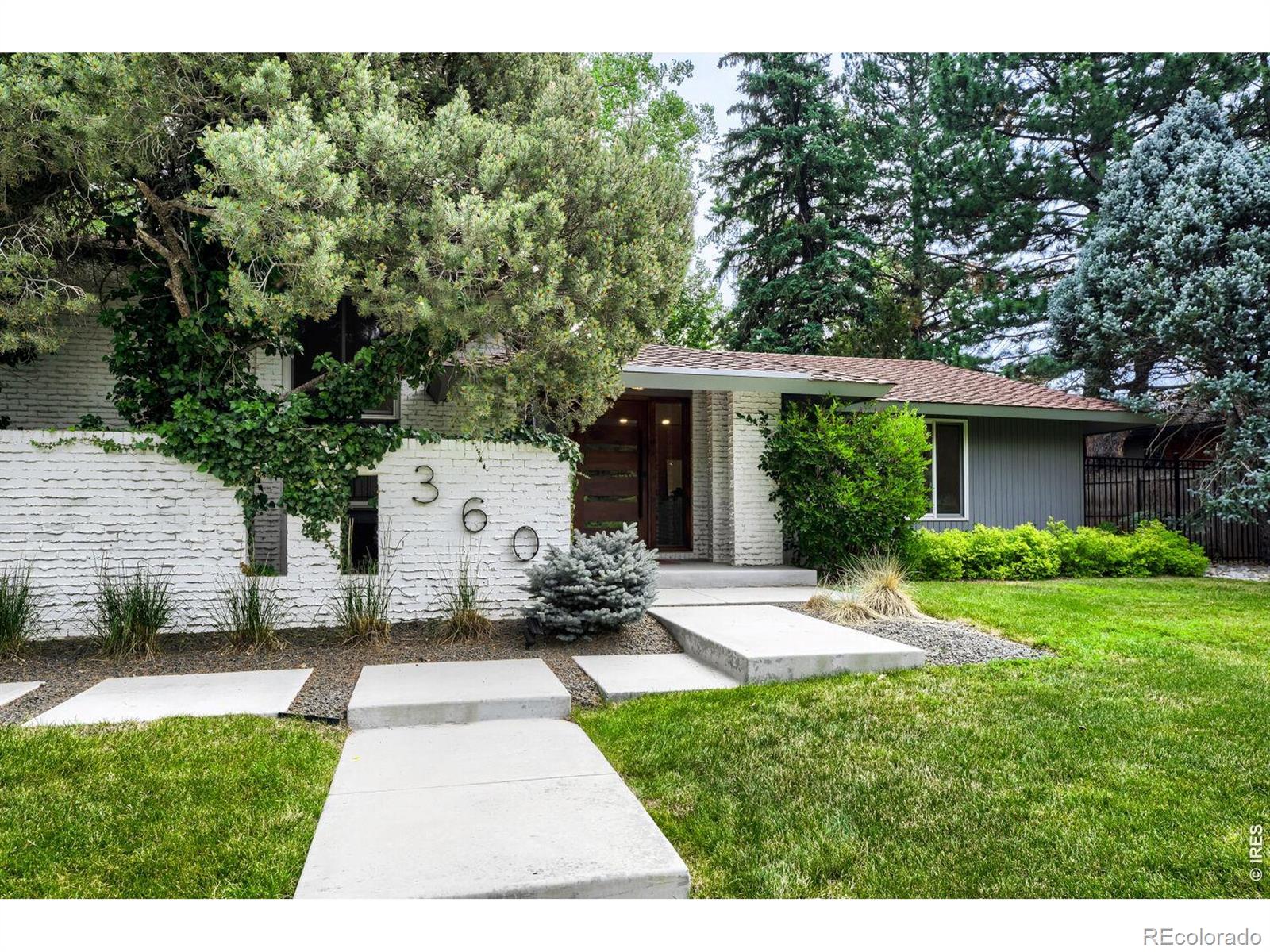 Spacious Frasier Meadows home set on a boulevard lot with great privacy and quiet, features many mid-century modern elements with large room sizes and functional floorplan. Living room and dining area offer cathedral ceilings and large windows, lower level family room including wet bar and fireplace. Primary suite with deck overlooking mature landscaping in the back yard, private 3/4 bath and walk-in closet. Many updates done including new Andersen windows and doors (2024), new front door and entry walkway/landscaping, fresh interior paint and new carpet on main and upper levels, electrical updates, some bathroom updates as well. Low maintenance brick exterior, fenced courtyard with brick paver patio, rear facing oversize garage. Wonderful opportunity in this sought after neighborhood to move right in or continue making this home your own. Convenient location for biking, trails, public transportation and access to downtown Boulder and the rest of the Denver metro area.