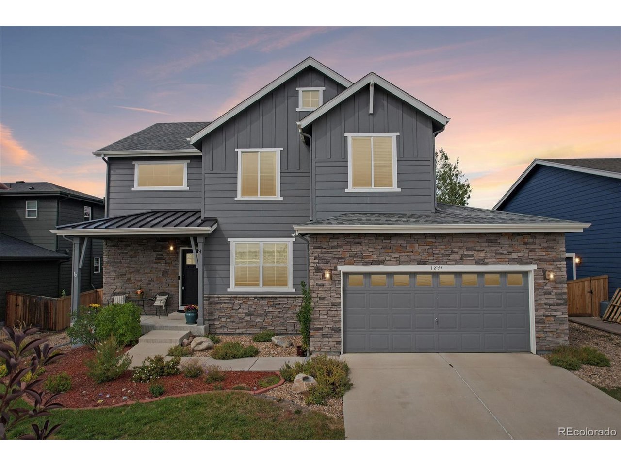 Welcome to this spacious, beautifully appointed residence in Erie's highly desirable Vista Ridge community! Set against a lovely neighborhood backdrop with scenic views of a neighboring ranch across the street, the home welcomes you with professional landscaping, a private covered front porch, and exceptional curb appeal. Step inside the grand foyer with soaring ceilings, where a bright dedicated office/flex room sits directly to your right. The main level flows into an open floor plan designed for effortless everyday living and entertaining, featuring a cozy living room anchored by a traditional fireplace. The adjacent dining area transitions seamlessly into a gourmet kitchen featuring sleek quartz countertops, rich cabinetry, a generous walk-in pantry, and direct access to the back patio. A convenient half bath and access to the attached garage complete the main floor. Upstairs, the spacious primary suite offers a serene retreat with a luxurious 5-piece en-suite bath and impressive walk-in closet. Three additional bedrooms share a stylish full bathroom. Downstairs, the finished basement adds exceptional living and entertaining space, highlighted by a large media area with a custom wet bar, along with a guest bedroom, full bathroom, and abundant storage. Outdoors, the fully fenced backyard creates a private open-air retreat. Frame-worthy mountain views provide a stunning backdrop for the lush lawn and mature shade trees, while a covered patio with an outdoor ceiling fan and additional sunny patio space offer ideal settings for warm-weather relaxation. Enjoy the sought-after Vista Ridge lifestyle with friendly neighbors, top-rated schools, and community amenities including a grand clubhouse, fitness facility, and two neighborhood pools!