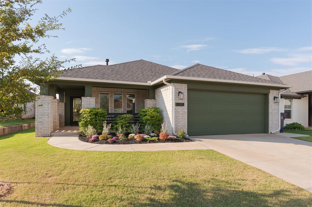 Welcome to this newer construction home in Knox Farm, where style meets function. Manicured landscaping and a covered front porch lead to the glass-paneled entry door, setting the tone for the home’s inviting character. Inside, 10-foot ceilings, eastern-facing windows, and easy-care vinyl plank flooring create a bright and open entry. The living area features a one-touch gas log fireplace with a tile surround and mantle, while the kitchen pairs modern design with everyday usability. Highlights include quartz countertops, a green tile backsplash, a natural wood-tone island with breakfast bar, and a dedicated pantry. The Whirlpool appliance package, gas range, and external ventilation make this a cook’s kitchen. The primary suite is a true retreat, offering a wallpaper accent wall, spa-like bath with quartz vanity and dual sinks, a tiled shower, free-standing tub, linen closet, and a generous walk-in closet. Additional upgrades include extra storage in the primary bath, a drop zone, hall bath enhancements, storm door at the garage entry, and extended guttering. Gold and black fixtures flow throughout, tying together the kitchen finishes and painted window trim. A spacious utility room and a practical mudroom near the garage keep coats, bags, and shoes organized. The well-planned layout provides separation between the primary suite and secondary bedrooms for privacy. Outdoors, the backyard is fully enclosed with a wood fence. Knox Farm offers sidewalks, a playground, and a splash pad, perfect for evening strolls or weekend play. Located within the Deer Creek school district, this home combines modern curb appeal with immediate availability — no waiting on new construction, it’s ready for its new owners today!