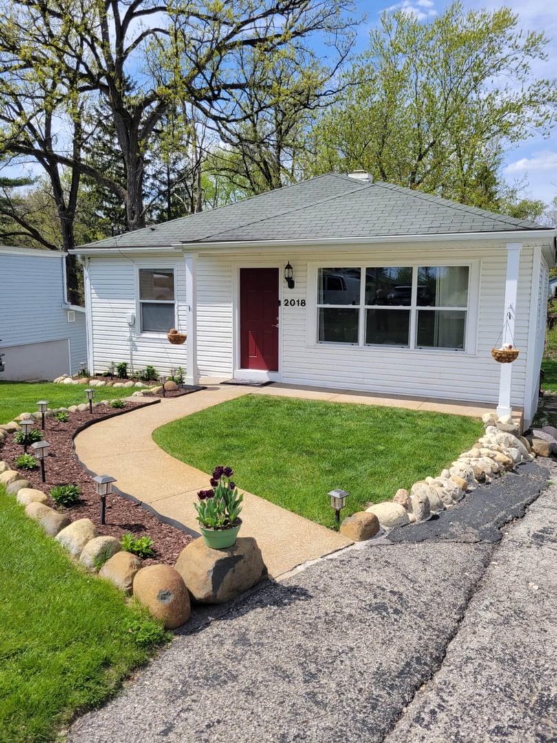 Rare opportunity featuring access to the Chain O' Lakes via the Fox River! Nestled along Cary Creek Channel, this beautifully renovated home offers a rare blend of modern updates and natural beauty, with direct access to the Fox River. Offering 1530 square feet above grade plus additional finished basement space, the home features 2 above-grade bedrooms, 1 below-grade bedroom, and 2 full bathrooms, providing exceptional flexibility for a variety of living arrangements. From the moment you step inside, you will appreciate the extensive renovations throughout. The home showcases updated electrical, insulation, and windows, along with soaring vaulted cathedral ceilings that create a bright, open, and airy atmosphere. The kitchen has been thoughtfully updated with new cabinetry and appliances, while ceiling fans throughout enhance year-round comfort. The upstairs was fully renovated in 2017, with the exception of the bathroom.    The finished basement offers incredible versatility, including a private in-law arrangement with a bedroom, full bathroom, and direct access to the backyard and creek. An oven hookup allows for a potential kitchenette, creating an ideal setup for extended living or guest accommodations. The opposite side of the basement is separately walled off with its own access, offering excellent space for storage, laundry, or a dedicated work or craft area.    This home has been meticulously maintained with major system updates already completed, including a brand new washer and dryer and high efficiency water heater in 2022, well pump, pressure tank, and softener in 2023, and a new roof, gutters, and portions of the HVAC system updated in 2024. The well was inspected within the past two years in conjunction with the hot tub permit, providing added peace of mind.    Step outside to your own private retreat. A spacious deck overlooks the expansive backyard and tranquil creek, with partial deck replacements completed between 2020 and 2024. Enjoy year-round outdoor living with a wonderful hot tub and gazebo, perfect for relaxing or entertaining in every season.  Stairs leading down to the river access have been newly replaced in 2025, offering easy access to the water. A large shed provides ample storage for tools and outdoor equipment. This water adjacent property is ideal for kayaking, fishing, or simply enjoying the peaceful surroundings. Conveniently located near downtown Cary, the Metra, shopping, parks, and more, this home offers the perfect balance of everyday convenience and serene, nature-filled living. With extensive updates, a flexible living space, potential for an in-law arrangement, and a truly exceptional setting, this move-in-ready home presents a rare opportunity. Schedule your private showing today. Professional photos will be added to the listing Saturday, March 21st**