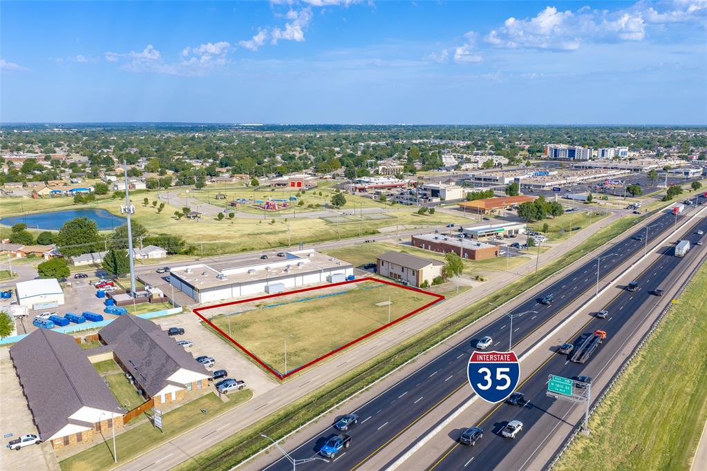 This 0.91-acre +/- vacant commercial lot is located along the N I-35 Service Road in Moore, Oklahoma. Zoned PUD, the property offers excellent visibility and exposure to heavy I-35 traffic, along with convenient interstate access.The site is located near numerous shopping, dining, and entertainment options, including a movie theater, placing it within one of Moore's most active commercial areas. With strong traffic counts, prominent visibility, and connectivity throughout the Oklahoma City metro, the property presents an opportunity for a variety of commercial uses, subject to approval by the City of Moore.A conceptual site plan is available showing an 11,020 SF building with 40 parking spaces, laid out for a shopping center use.