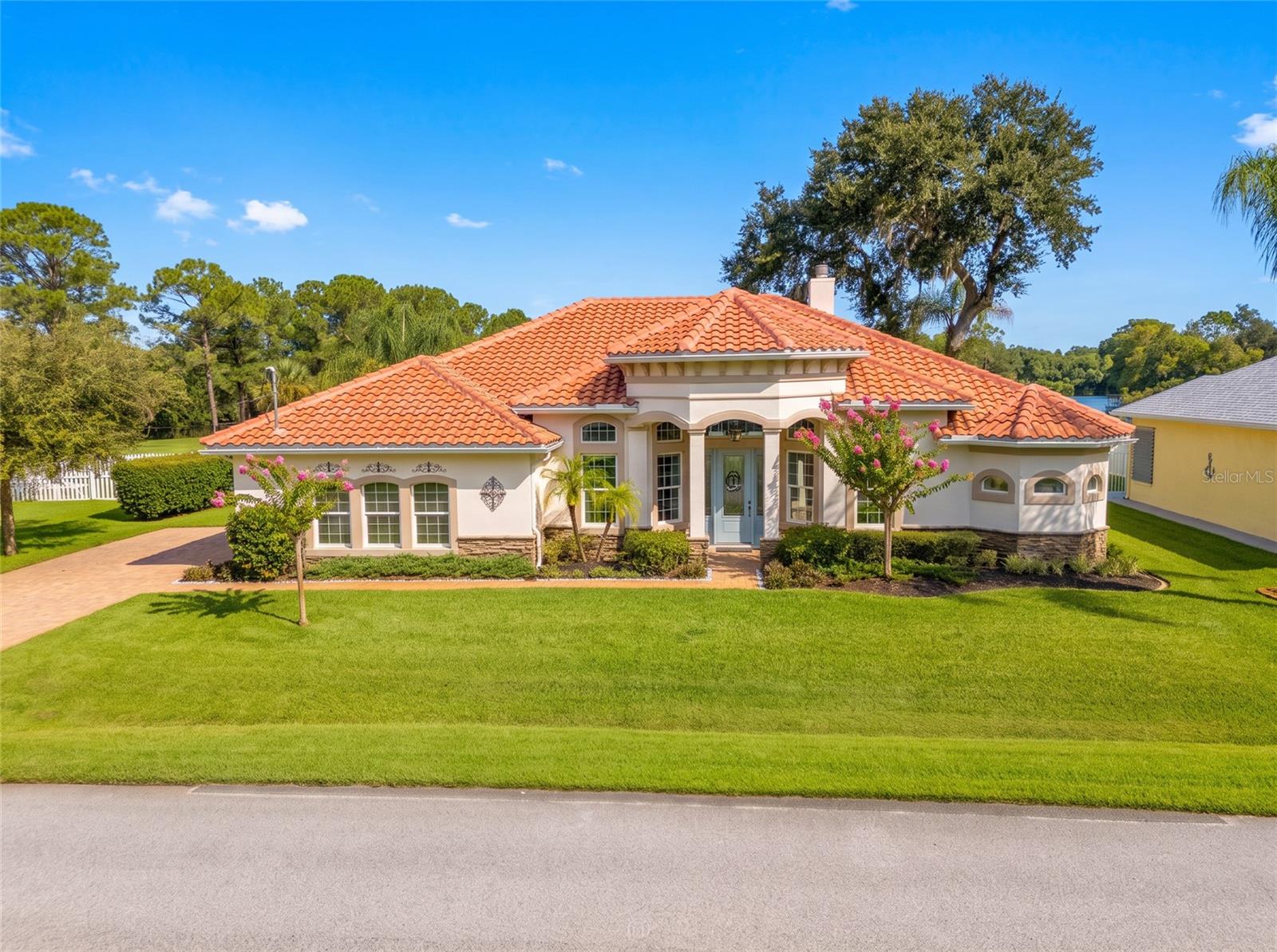 Under contract-accepting backup offers. IT’S ALL ABOUT THE VIEWS! Welcome to this stunning 2017 custom-built concrete block and stucco home offering breathtaking lakefront living with NO HOA. Step through the glass front entry into a light-filled interior featuring transom windows, vaulted ceilings, and a modern open floor plan—complete with formal dining, a spacious living area, and a family room. Step outside to your private oasis featuring a 2021-built heated saltwater pool, perfect for swimming laps or relaxing. Launch your kayak right from your backyard for fishing and birdwatching! Upgrades include a fireplace, custom window treatments, water softener system, energy-saving hybrid water heater, all appliances, garage storage racks, and lawn irrigation. A rare blend of modern luxury, nature, and total freedom—schedule your showing today!
