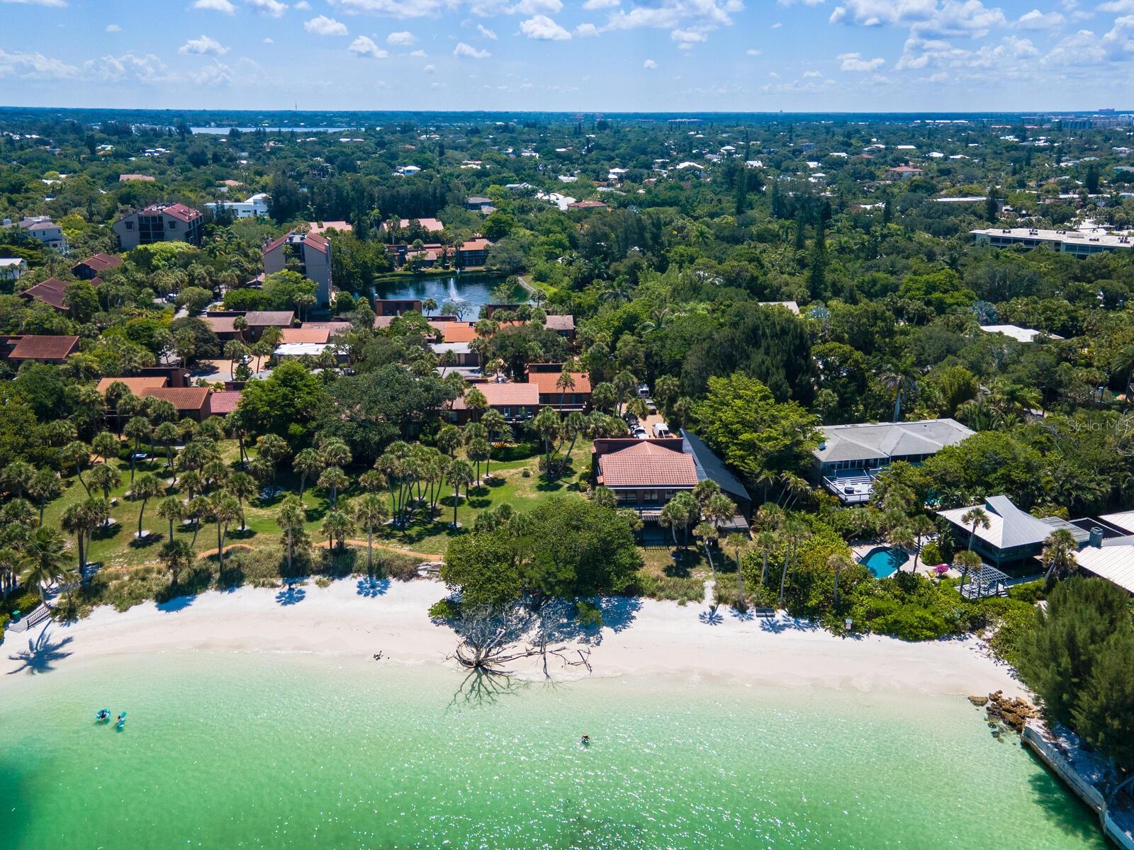 Introducing a charming one-bedroom, one-bathroom condo in the heart of Siesta Key, where Old Florida charm meets modern coastal living. This elevated second-floor unit offers a bright, inviting living space set within a secluded, tropical oasis designed by the renowned Frank Folsm Smith of the Sarasota School of Architecture. Enjoy peace of mind with no history of storm damage in this elevated location, and savor private access to a community beach and fishing pier just steps away. From the private beach, you can watch dolphins play in the Gulf as you unwind to sea breezes and tranquil sunsets.This distinctive enclave blends architectural pedigree with lush, mature landscaping and a resort-like atmosphere, providing a rare combination of privacy and coastal convenience. The property is perfectly positioned within easy reach of Siesta Key Village, where you’ll find a vibrant mix of restaurants, live music, and boutique shopping. Whether you’re seeking a full-time residence or a carefree vacation getaway, this condo offers a low-maintenance lifestyle without sacrificing character or location.Why you’ll love it: a compact, stylish retreat with direct beach access, private coastal views, and proximity to village amenities all in one package. It’s an excellent option for year-round living or a tropical getaway, combining unique architecture, serene grounds, and a distinctive Siesta Key experience. Schedule a private tour to experience this exceptional property firsthand.