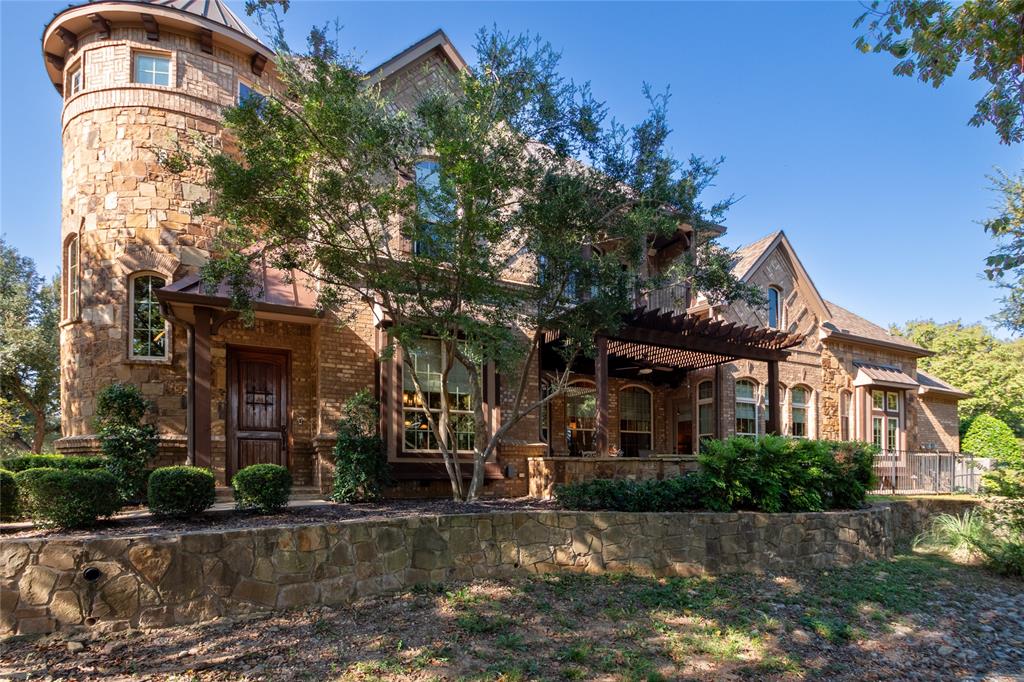 Beautifully upgraded end unit townhome in gated Heritage Oaks of Colleyville! This 3,200 sq. ft. home offers 3 bedrooms, 2.5 baths, downstairs office and a 2-car garage. Features include a gourmet kitchen with granite counters and walk-in pantry, stunning rock features, elegant millwork, wine cellar, and custom built-ins. Upstairs boasts a spacious game room with billiards table and tiered media room with snack bar. Enjoy outdoor living with a covered patio and second-level balcony. Located in highly rated Grapevine-Colleyville ISD walking distance to schools, this move-in ready home blends luxury, comfort, and convenience in a secure community.