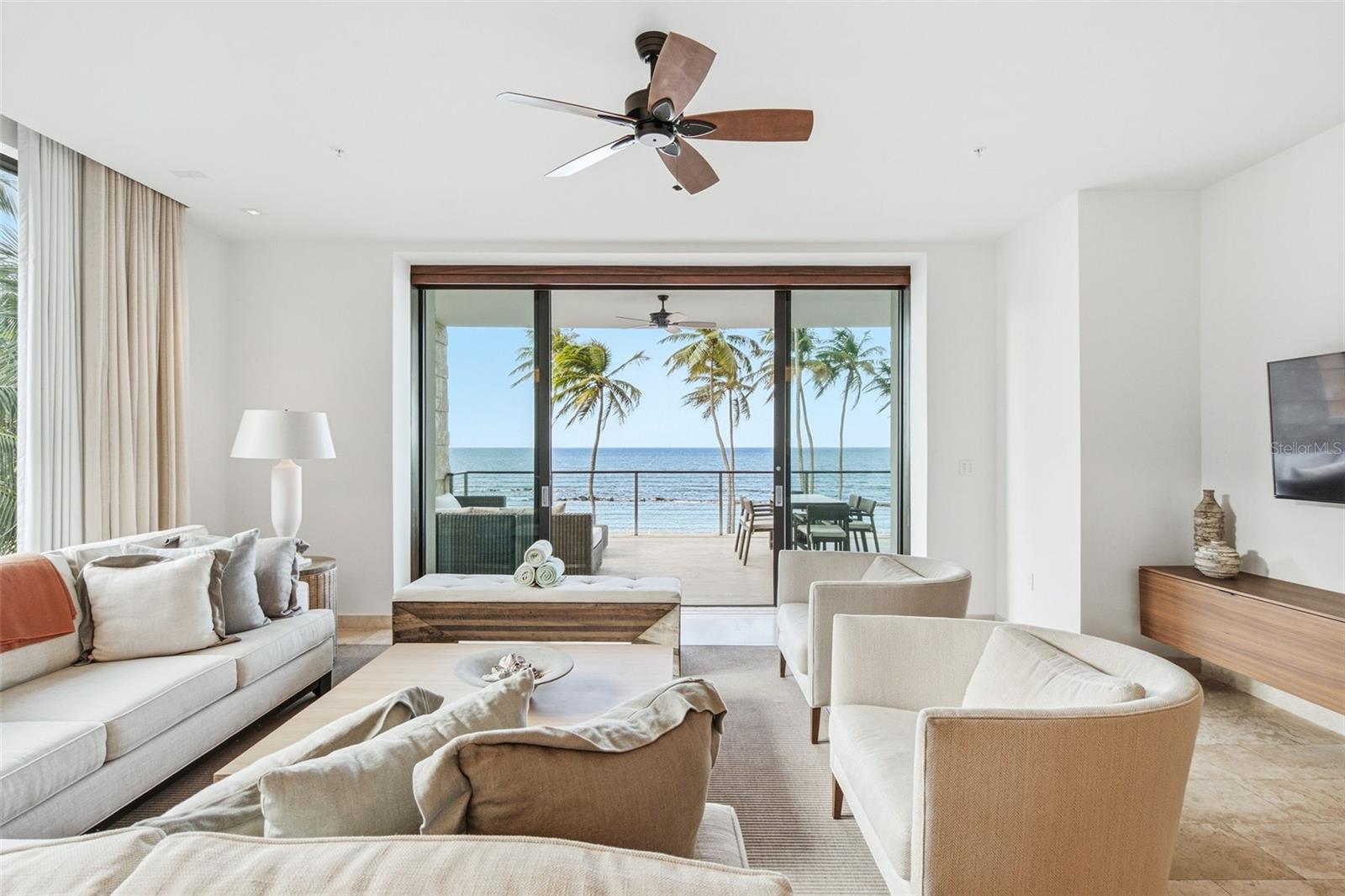 Set along the beachfront within West Beach at Dorado Beach, a Ritz-Carlton Reserve, this residence offers direct access to the sand and the distinctive lifestyle of one of Puerto Rico’s most sought-after resort communities. Encompassing 3,543.92 square feet of interior living space, excluding exterior areas and additional balconies, the residence features two bedrooms, three full bathrooms, and a versatile bonus room currently configured as a media room. The flexible space can easily adapt to serve as an office, guest room, or private retreat. Generous living areas open to multiple balconies and exterior spaces, creating a seamless connection to the surrounding tropical setting. Residents of West Beach enjoy the services and amenities of Dorado Beach, including championship golf, exceptional dining, spa and wellness experiences, and signature Ritz-Carlton Reserve service.
