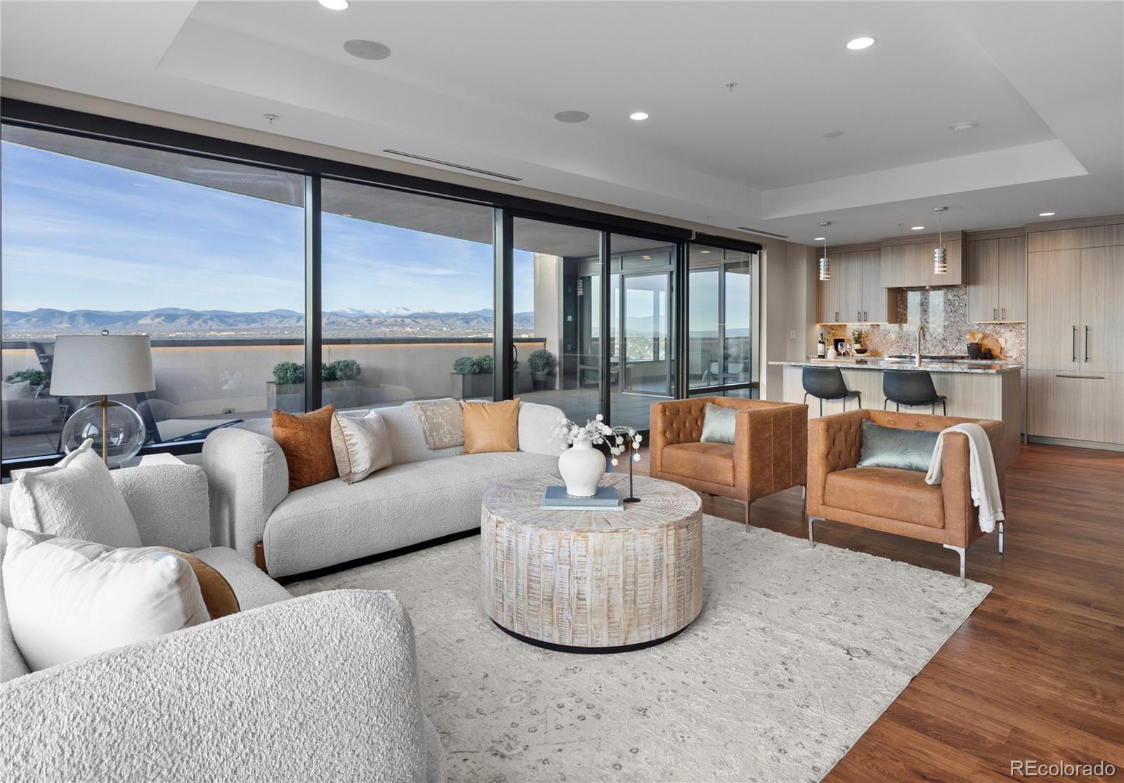 A rare offering in one of Denver’s most coveted addresses, residence #2430 set within Denver's iconic Four Seasons Private Residences, delivers an extraordinary blend of luxury, privacy & breathtaking natural beauty. Encompassing 1,951 Sq Ft, this southwest-facing corner home is the only 2-bed residence in the building that pairs uninterrupted mountain views w/ an expansive 615 Sq Ft private terrace—the largest among all 2-bed floor plans at the Four Seasons.From the moment you step inside, the panorama unfolds: sweeping 180-degree views of the mountains & city skyline that transform daily life into a cinematic experience. The oversized terrace becomes a true extension of the home—perfect for outdoor dining, entertaining, or simply savoring Denver’s legendary sunsets. The open-concept kitchen, living & dining areas are framed by floor-to-ceiling sliding glass doors that blur the line between indoors & out. Custom built-ins & a elegant fireplace anchor the living space. The brand-new chef’s kitchen is a showpiece in its own right, featuring a striking granite backsplash, top-tier appliances & generous island w/ seating. The west-facing primary suite offers stunning mountain views & direct terrace access. Its en-suite bath is a spa-inspired retreat w/ floor-to-ceiling marble, dual sink vanity & spacious walk-in closet. A large secondary bedroom provides comfort & privacy for guests, complete w/ custom closet built-ins & oversized en-suite bath. Additional features include a large entry foyer, powder room, hardwood flooring & automatic shades throughout, 2 reserved parking spaces & storage. As an owner, you’ll enjoy the unparalleled lifestyle that only the Four Seasons can provide; including 24-hour concierge, security, & valet, full-service spa & fitness centers, outdoor heated pool, in-residence services & dedicated residential management team. Delivering an unmatched luxury lifestyle in the heart of downtown Denver.