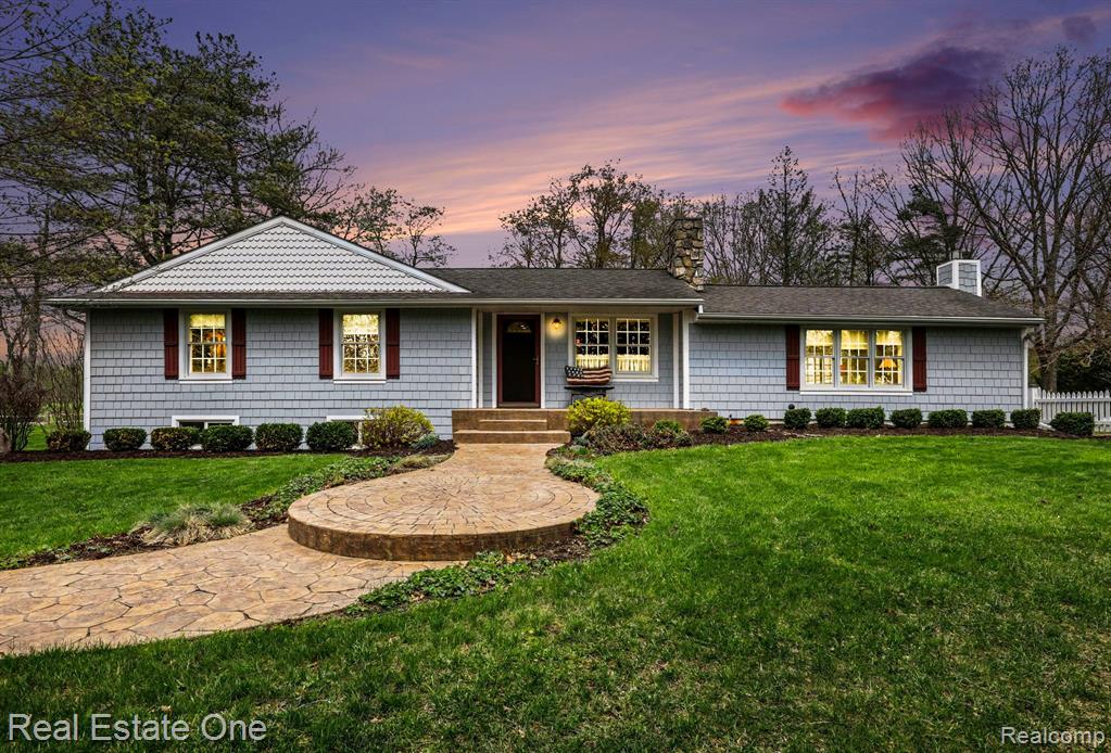 This is the sanctuary that you've been waiting for! Extraordinary 10 acre country retreat is nestled within the coveted Metamora Hunt Country! Prepare to be RELAXED and REJUVINATED! Unparalleled views from every window. Watch wildlife graze as you enjoy cooking meals in the updated Chef's delight kitchen. Plethora of cabinetry, oversized farm style sink, quartz countertops, subway tile backsplash, snack bar & large walk-in pantry!  Expansive breakfast nook w/coffee bar area is light and bright! Spacious formal dining room! Private home office w/french doors add to the home's exceptional functionality & charm. Hardwood flrs & upgraded newer carpeting bring a nice warmth t/o! Relax in the Living Rm w/quaint fireplace and MILLION DOLLAR views! Andersen sliding doors create easy access to backyard oasis! The open floor plan compliments modern lifestyles, with the comfort of country living.  The 1st flr Primary Bdrm w/ensuite shower overlooks serene front yard pond. Flanked on the opposite side of home, you will find a full bath w/tub and add'l nicely sized bdrm w/amazing views of backyard stream. Lower level offers a Fam Rm w/fireplace and built-in niches. Add'l bdrm, 1/2 bath, huge WIC/flex room -- making it ideal for guests or extended family! Separate private entry w/direct stair access, provides versatile flexibility for use! Large utility/storage room and laundry area! Head outside and fall in love w/the 20'x20' outbuilding, aka "DIVA DEN"! Claim it as your dedicated getaway space! This exceptional property includes a spring-fed pond & stream. White picket fences, variety of flowering trees/bushes compliment the prof landscaped backyard. Stamped concrete tiered patios, pergola, fountain & firepit w/benches! Oversized garage offers dedicated workshop for all of your projects! Horseshoe driveway! Come witness the peaceful SERENITY for yourself! Close to Seven Ponds, Whigville Lake, 146-acre Jonathan Woods Nature Preserve and more! Oxford schools!