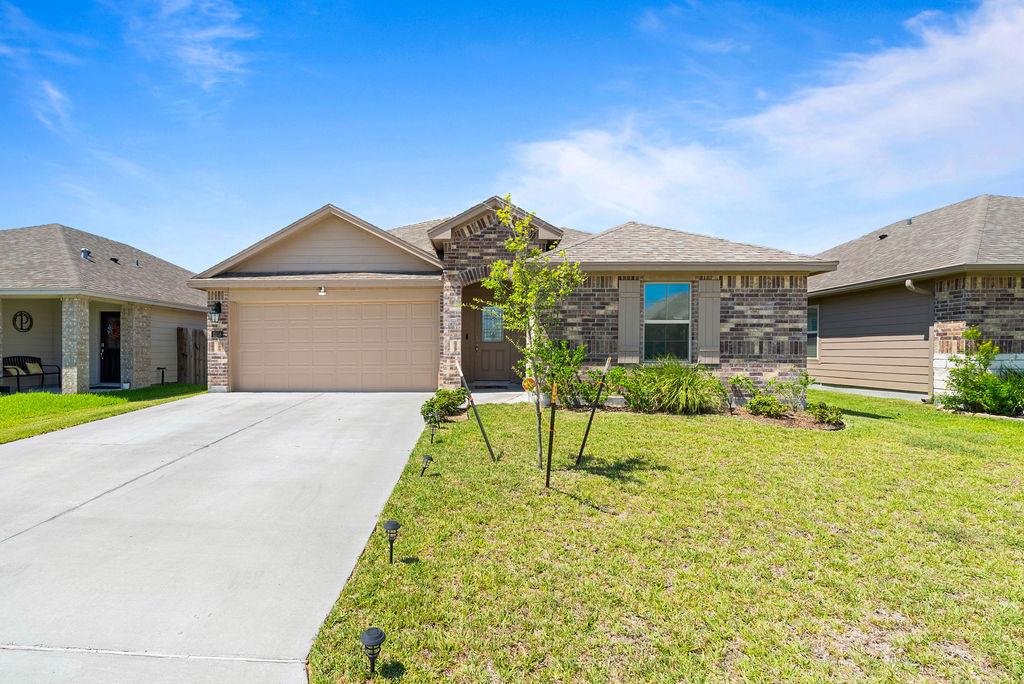 This 4 bedrooms home blends modern comfort with thoughtful Elgin floor plan design. The welcoming foyer opens to a spacious, light-filled living area with an open-concept perfect for everyday living and entertaining. The gourmet kitchen features granite countertops, stainless steel appliances, white tall cabinets, a gas range, breakfast bar for extra sitting, and corner pantry. The primary suite offers a walk-in shower, double vanity, and large closet, while the 3 other bedrooms layout ensures privacy for guests.Enjoy energy-efficient spray foam insulation, ceramic tile flooring in the entry, living, and all wet areas, plus easy smart features. Outdoor living shines large rear covered patio overlooking the spacious backyard. Nearby access to all London ISD schools, and quick commutes—just minutes to shopping, dining, the Corpus Christi airport, and local beaches.