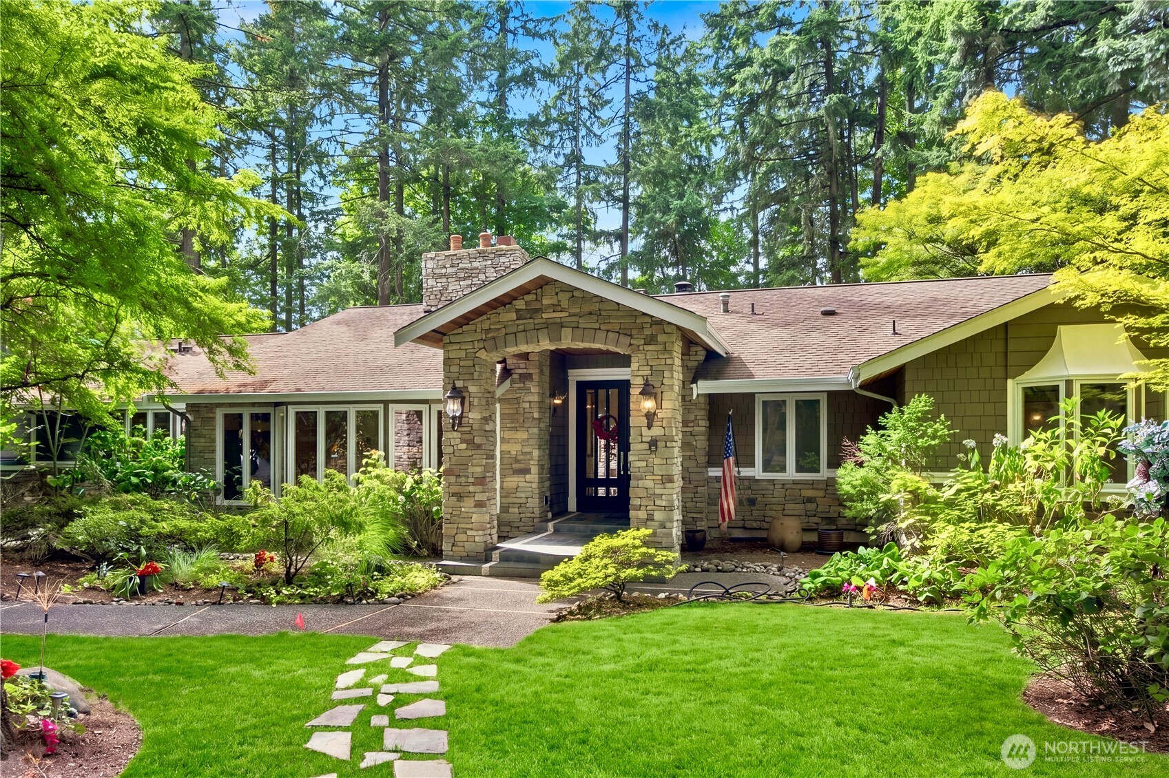 Tucked away in the coveted Bridle Trails community, this extraordinary 1.03-acre estate offers a rare blend of privacy, scale, and timeless elegance. Surrounded by mature trees and serene woodland, it feels like a private sanctuary while remaining minutes from Bellevue, Seattle, Kirkland, Redmond, and the Eastside’s leading technology campuses. Offered for the first time in 11 years, this meticulously cherished residence features approximately 5,180 square feet of refined living space, with 4 bedrooms and 4.5 baths. The elegant floor plan is designed for both sophisticated entertaining and everyday living, highlighted by a dramatic vaulted living room with stone fireplace, private den, gourmet kitchen with granite countertops and stainless-steel appliances, and expansive family room opening to a covered deck overlooking the lush grounds. The private primary suite features its own fireplace, luxurious five-piece bath, and French doors to a secluded deck. The garden-level entertainment wing offers a home theater, recreation room, exercise room with sauna, and elegant wine-tasting room. Multiple fireplaces throughout add warmth and character. Located in the highly regarded Bellevue School District and served by Cherry Crest Elementary, Odle Middle School, and Sammamish High School, this exceptional estate offers a rare combination of privacy, space, connectivity, and lifestyle.