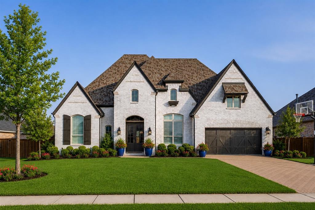 Stunning Highland Single-Story Masterpiece in Premier Star TrailExperience luxury living at its finest in this impressive Highland Home, perfectly positioned on an oversized 12,000+ sq. ft. lot in Prosper’s highly acclaimed Star Trail community. Built in 2020, this single-story residence blends sophisticated modern design with functional elegance across 3,216 square feet of living space. The grand entry sets a striking tone with soaring tray ceilings, designer lighting, and wide-plank hardwoods that lead into a majestic open-concept floor plan. Tucked behind glass French doors, the executive study offers a dream workspace with a full wall of floor-to-ceiling custom built-ins. The heart of the home is a show-stopping great room featuring spectacularly tall ceilings and a gourmet chef’s kitchen. Anchored by a massive quartz island with bespoke millwork, the kitchen is equipped with premium stainless steel double ovens, a gas cooktop, and a custom-tiled beverage station with integrated wine storage. Retreat to the palatial primary sanctuary, where vaulted ceilings lead to a spa-inspired ensuite. Indulge in the freestanding soaking tub or the oversized walk-in shower with designer slate tile and mosaic accents. All four bedrooms are strategically placed around the home's perimeter for maximum privacy, each featuring its own walk-in closet. Bonus spaces include a dedicated first-floor media room, perfect for movie nights. Step outside to a huge outdoor entertainment space with a covered veranda, ideal for hosting year-round. Located in the top-rated Prosper ISD (Joyce Hall Elementary) with NO MUD or PID, residents enjoy world-class Star Trail amenities including four pools, tennis and pickleball courts, and miles of walking trails.