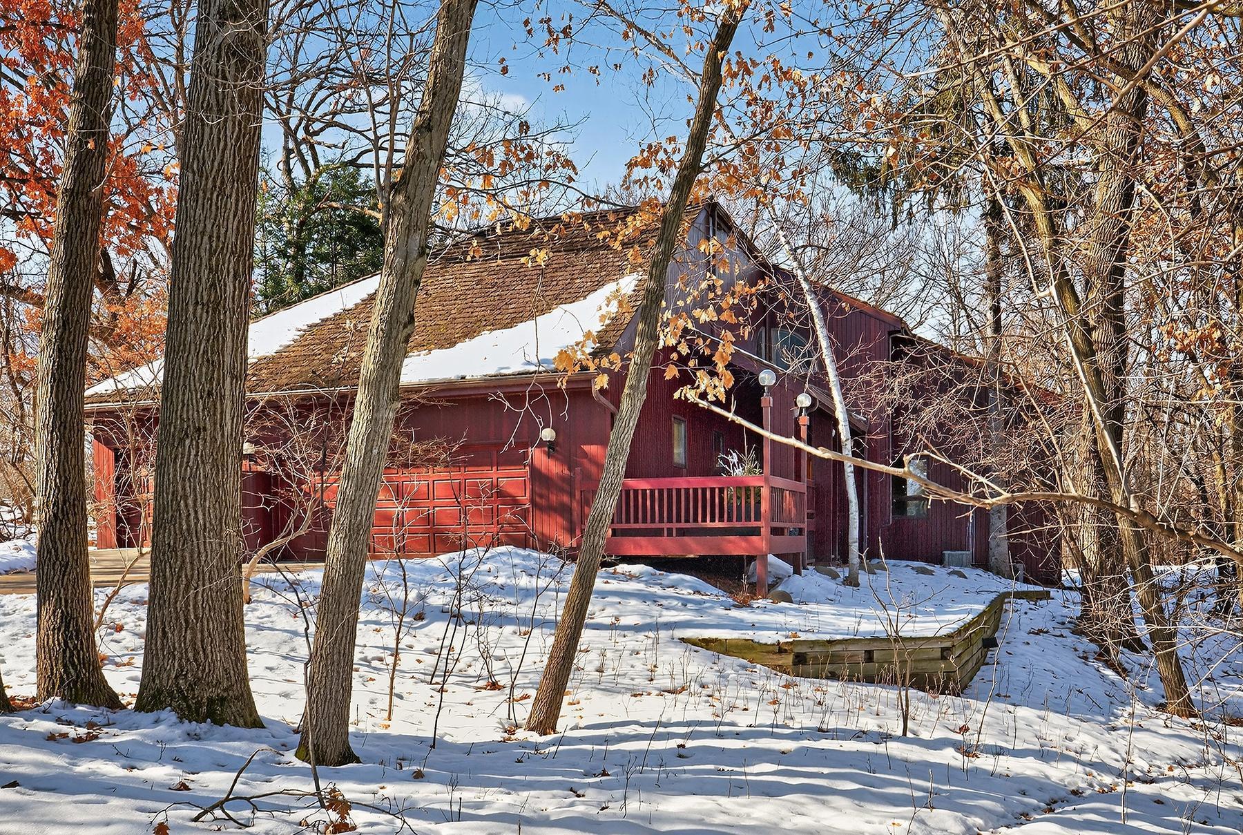 This distinctive custom home is located in a very desirable neighborhood in West Bloomington one block from Bush Lake.    Main floor offers a spacious two-story living room with a custom stone fireplace and large picture windows overlooking the private wooded lot. Family room with corner windows and a wood burning stove. Separate formal dining room with a curved wall and glass to a deck. Eat-in kitchen with a center island, high-end stainless appliances and granite countertops. Adjacent to the kitchen and informal dining is a two story glass solarium with exceptional light and in floor heating. Upper level has a primary suite with a sitting room, office area, walk-in closet and a luxury bath with separate tub and shower. Walkout lower level has a family room with a fireplace and access to a patio and private backyard. Newly updated ¾ custom bath adjacent to the two bedrooms. Large utility room with ample storage. 9208 Yukon is situated in a beautiful neighborhood of West Bloomington.