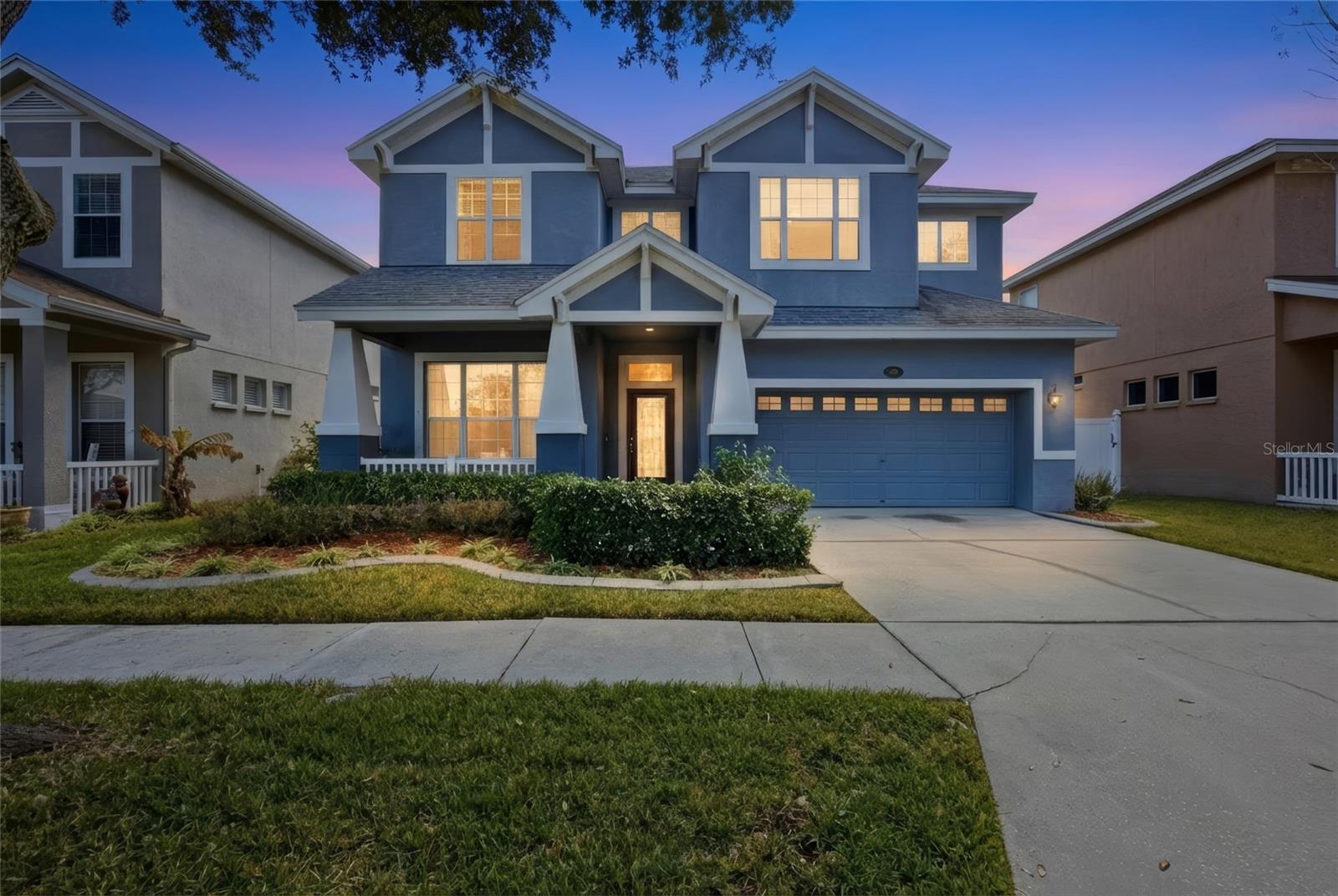 Welcome to 5112 Pheasant Wood Dr, a beautifully maintained residence nestled within the highly desirable Reflections community. Set in a top rated school district with NO CDD and a LOW HOA, this home offers comfort, efficiency, and peaceful lake view living. Designed to highlight its scenic backdrop, two expansive sets of TRIPLE SLIDING GLASS DOORS frame tranquil water views while filling the kitchen and family room with natural light and creating an effortless indoor-outdoor flow. Thoughtful upgrades provide long term value and peace of mind, including an OWENS CORNING PLATINUM ROOF (2020), HARDIE BOARD FASCIA (2020), SWISS KRONO LAMINATE FLOORING throughout downstairs except wet areas (2025), DUAL 15 SEER HVAC SYSTEMS, LENNOX GAS FURNACE (2021), and FLUSH MOUNT HURRICANE PANELS.At the heart of the home, the kitchen blends functionality with warmth, featuring 42 INCH SOLID WOOD SHAKER CABINETRY, a GOURMET DOUBLE OVEN, and a spacious WALK-IN BUTLER’S PANTRY. Architectural details such as CROWN MOLDING and TRAY CEILINGS add timeless character throughout. Outdoor spaces are equally inviting with BRICK PAVER PORCHES, PVC FENCING, RAIN BIRD IRRIGATION SYSTEM, and mature TROPICAL LANDSCAPING, all positioned on a quiet cul de sac just a short walk to the community pool.Conveniently located near dining, shopping, medical facilities, with quick access to the Veterans Expwy and N.Dale Mabry HWY and approximately 15 minutes to TAMPA INTERNATIONAL AIRPORT. Schedule your private showing today!