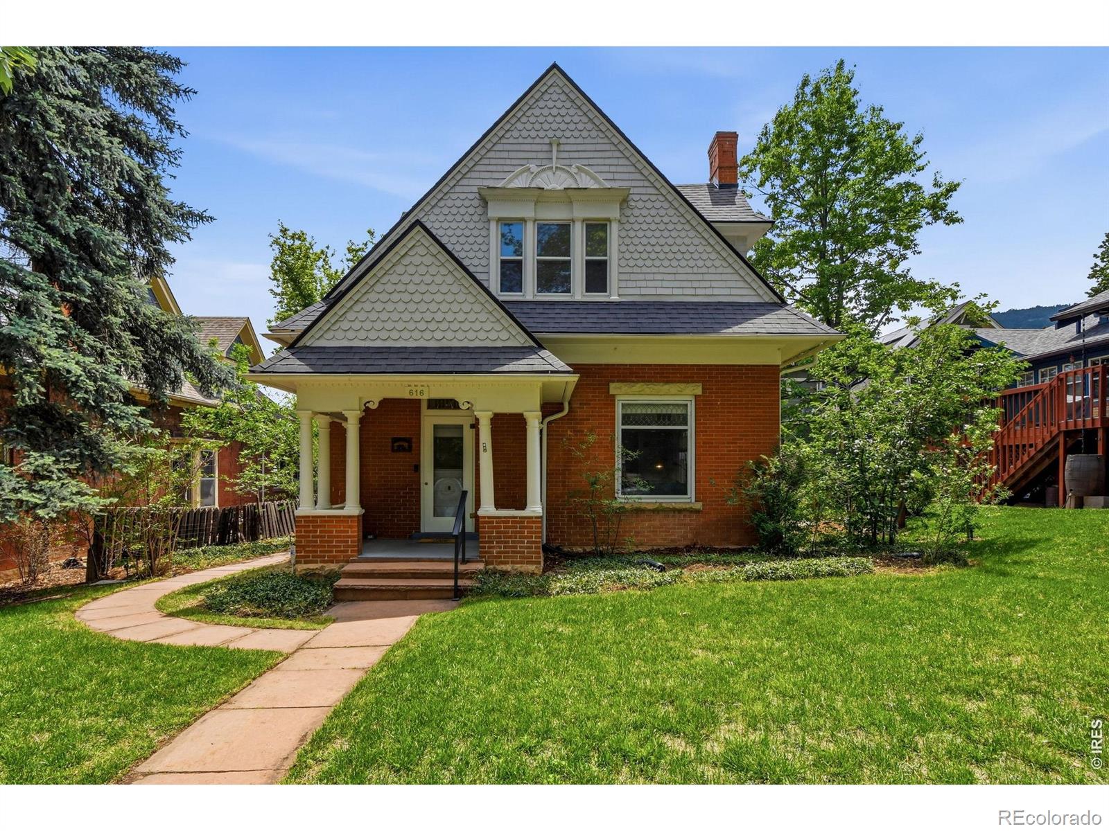 Set on a tree-lined street in Boulder's iconic Mapleton Hill neighborhood, this cherished Queen Anne Victorian comes to market for the first time in over 35 years. It's the kind of block where neighbors wave from front porches, dogs meander down sun-dappled sidewalks, and summer brings neighborhood events like the legendary Mapleton Hill Porchfest - live music drifting through the air, community in full bloom. Pearl Street's world-class dining, shopping, and culture are mere seconds away, and trailheads like Mt. Sanitas are moments from your door. The location is, simply, unmatched. Inside, authentic character that can't be replicated: original hardwood floors, classic doors, and timeless millwork speak to a craftsmanship era long past. This is a rare opportunity for a new steward move right in or bring the vision to restore it to its full, glorious potential. Outside, a lovely fenced yard and expansive patio beckons you to relax long into the evening with friends. Above the garage, a versatile studio opens the door to possibility: home office, music room, creative retreat, or guest suite. 616 Pine is a private oasis in the heart of the city. LIVE BOLDER, LOVE BOULDER!