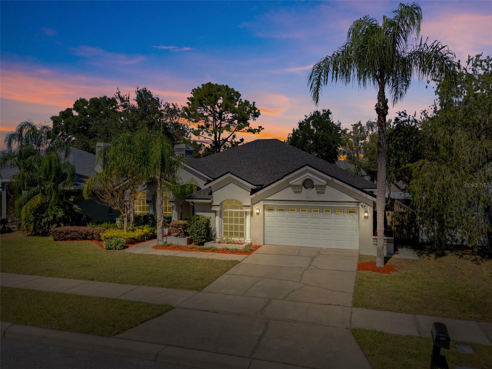 One or more photo(s) has been virtually staged. Featuring a new roof installed in October 2025, this stunning four-bedroom, three-full-bath pool home is in the charming Walden Lake Community and offers a blend of modern upgrades and comfortable living. Enter inside to an interior that boasts a full paint refresh in 2025 and beautiful, durable walnut wood-like ceramic tile flowing throughout the main living areas and primary suite. The primary suite features a large spa-like bath with a frameless glass shower, a deep soaking tub, dual vanity, a private water closet, and is complemented by a spacious walk-in closet. The home is filled with convenient touches, including remote-controlled blinds and a sophisticated security and camera system for peace of mind. A unique pass-through fireplace connects and elevates the dual living spaces. Enjoy seamless indoor/outdoor Florida living with direct slider access to the expansive screened lanai and sparkling heated pool from the family room and primary bedroom. The outdoor oasis is designed for entertaining and convenience, featuring an essential outside bath access for easy cleanup. Other notable upgrades include a private fully fenced backyard, zoned irrigation system and an attached two-car garage. Living in Walden Lake means enjoying a well-established community known for its tranquil environment, lush landscapes and exceptional amenities, which include a large central lake with a community boat ramp and fishing dock, a large park and playground, and serene nature trails. Furthermore, Plant City is known for its charm and convenience, placing you near the famous Florida Strawberry Festival, local dining spots and providing an easy commute to major attractions such as Busch Gardens and Raymond James Stadium, as well as Orlando's world-famous theme parks.
