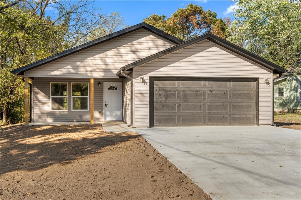 Brand-New Construction Home in Nevada, MO!

Welcome to this move-in ready, all-electric, energy-efficient home in Nevada, Missouri. Featuring 3 spacious bedrooms and 2 modern bathrooms, this new construction is designed for everyday comfort and lasting quality.

The open-concept layout connects the living, dining, and kitchen areas for a bright, welcoming flow. The kitchen stands out with white cabinetry, a quartz waterfall island, and stainless steel appliances — including a dishwasher and range.

Luxury vinyl plank flooring runs seamlessly throughout the entire home, offering a clean, cohesive look that’s both durable and easy to maintain. Both bathrooms feature modern fixtures and bright finishes, and the attached two-car garage adds everyday convenience.

This all-electric home is built for energy efficiency and low-maintenance living. A one-year builder’s warranty provides added peace of mind as you settle in.

Located in Nevada, MO, the home offers quick access to local parks, schools, medical facilities, and the historic downtown district — a great blend of modern comfort and small-town convenience.

Modern design. Smart efficiency. Move-in ready in Nevada, Missouri.