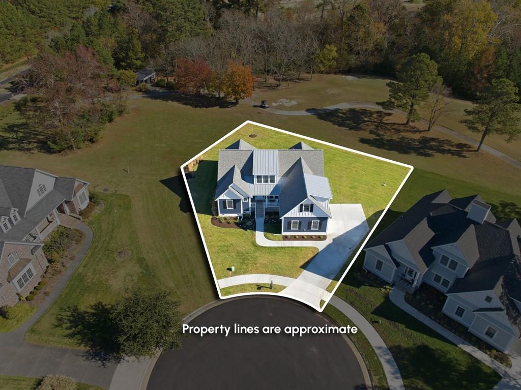 Coastal Living, Elevated – $25,000 Credit (with acceptable offer) toward Bay Creek Sports Membership. Welcome to 4 Martz Court, a beautifully designed 5BR, 3.5BA Ruiz Custom Home overlooking the 14th hole of the Arnold Palmer Signature Course. Enjoy panoramic fairway and preserve views, stunning sunsets, and added privacy with no rear neighbors, all on a spacious cul-de-sac lot in a mature neighborhood. The open floor plan features a gourmet kitchen with two oversized quartz islands and stainless steel appliances, a spacious living room with gas fireplace and custom built-ins, and a versatile flex room ideal for office or media use. Additional highlights include a 2-car garage and dual-zone HVAC. Larger than it appears and thoughtfully designed for comfortable, elegant coastal living.