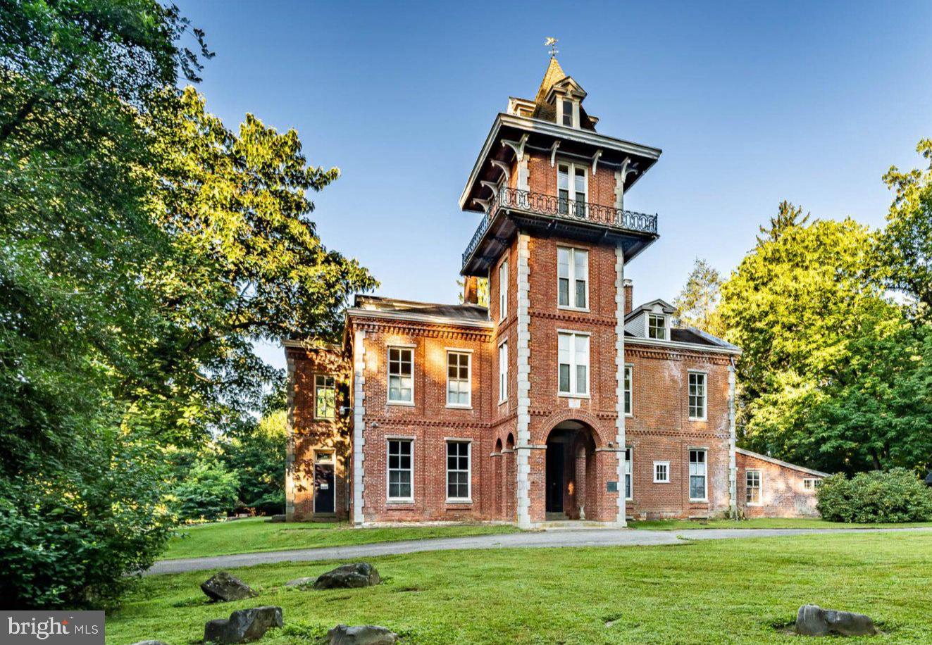 Constructed in 1860 by renowned author, world traveler, and diplomat Bayard Taylor, Cedarcroft is arguably one of the most iconic homes in the state and celebrated historic homes in the tri-state area.  In 1972, Cedarcroft was added to the National Historic Registry by the U.S. Department of Interior.  Taylor was widely known for his extraordinary travels, literary works, travel books, poetry, and was the first author to pen the folklore tale, “Beauty and the Beast.” Cedarcroft became a gathering place and artist colony for some of the most prominent literary figures of the 19th century. Among its legendary guests were Ralph Waldo Emerson, John Greenleaf Whittier, James Russell Lowell, and Horace Greeley. Taylor himself is said to have overseen the construction of the home, a magnificent brick Italianate residence that he described as “large and stately, simple in its forms, without much ornament … expressive of strength and ornament.” Cedarcroft remains an exceptional example of its period, thoughtfully updated while retaining the character and grandeur that define this remarkable property. The first floor features impressive 13-foot ceilings and a gracious Entry Hall anchored by a grand staircase leading to the upper levels. The spacious Living Room and Family Room—each feature handsome fireplaces, and are separated by a Billiards Room. The elegant Dining Room off the Foyer, the Family Room, and Kitchen, is highlighted by another beautiful fireplace. The well-appointed Kitchen is also conveniently accessible from the Entry Hall and features a comfortable Breakfast Area. Just beyond the Kitchen, the back hall provides access to a Pantry and Powder Room. A spacious Mud Room is located adjacent to the Kitchen and offers a practical transition to the attached two-car garage, providing exceptional convenience for everyday living. The second level, with 11 foot ceilings, features a spacious Primary Suite with fireplace, en-suite bath, and a generous walk-in closet and dressing area. Through the dressing area is a second master bedroom with its own fireplace and access to the walk-in closet.  Four additional second floor bedrooms, one with en-suite bath, provide exceptional flexibility. The second floor also includes three bathrooms and a laundry room with kitchenette. The homes truly unique Tower offers a  charming retreat with three additional levels, each with its own HVAC system. Whether envisioned as a private reading room, creative studio, or simply a quiet place to take in the views, these distinctive spaces invite the imagination.  The Tower’s balcony is off the 4th floor of the Tower.  The home’s third floor includes an additional bedroom and storage rooms, as well as the air-handling equipment serving the home's central air-conditioning and heating system. The basement is accessed from the garage and includes a root cellar with tremendous potential for restoration into a spectacular wine cellar—an opportunity befitting a home of this stature. The current owner has lovingly undertaken extensive updates to the property's systems, including a new roof, updated electrical, installation of a geothermal heating and cooling system, and connection to public water and sewer, as well as a new kitchen, laundry room and powder room.   These tasteful updates provide modern infrastructure while preserving the home's historic character. Set on 2.3 picturesque acres within the highly regarded Unionville-Chadds Ford School District, Cedarcroft represents a rare opportunity to own not simply a historic home, but a genuine piece of American history. Properties of this stature and significance rarely come to market, making Cedarcroft an extraordinary offering for the discerning buyer who appreciates architecture, history, and the enduring legacy of a truly remarkable home. You can read more about Cedarcroft’s history and influence on American culture and architecture on its Wikipedia page.