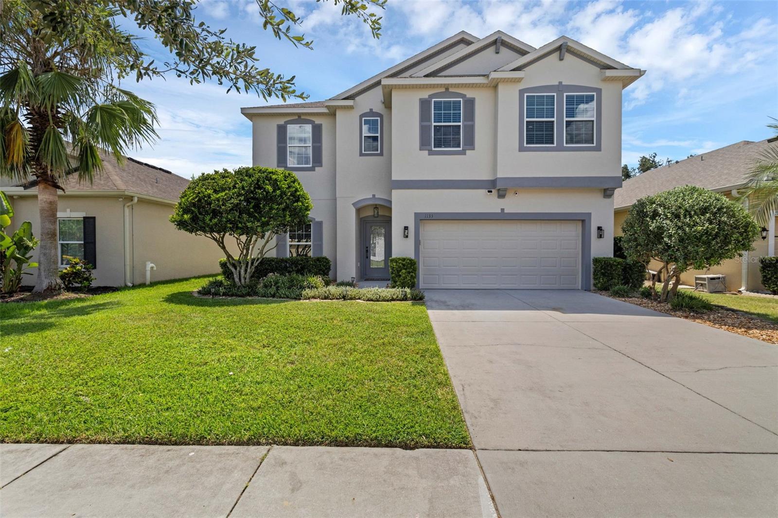Located in the sought-after gated community of Waterside Pointe, where living the luxurious Lake Life, can be your new reality. This Chain of Lakes property is turn key and freshly upgraded featuring four-bedroom and three baths. This Florida Paradise boasts fresh interior paint, upgraded baths, and upscale finishes. Past the foyer, you are greeted with an open floorplan featuring the kitchen, breakfast nook, and family room combo. This floor plan also offers an additional flex space, ideal for formal dining or a home office. Enjoy entertaining in your wonderfully updated kitchen with New Quartz Countertops featuring a waterfall edge, double oven, and Stainless-Steel appliances. Relax in your primary suite, that features a large walk-in closet, upgraded vanities with his / her sinks, quartz countertops, freestanding tub, and large walk in shower. Additional spacious bedrooms are opposite the master and offer plenty of closet space. Step out back, and that’s where the fun begins. This backyard paradise is an outdoor enthusiast dream. Enjoy this large heated saltwater pool, featuring a sun shelf, Pebble Tec surfacing, multiple fountains, and an elevated heated spa. This home is located on a canal that directly leads to Clermont Chain of Lakes. Dock your boat outback, take a boat ride to the Tiki Bar or Salt Shack, sunset cruises with friends and family, and enjoy what Florida’s Lake lifestyle has to offer. This home also features tropical and lush landscaping that is great for privacy. Waterside Pointe has several great amenities: community pool with water slide, basketball and tennis courts, playgrounds, private boat ramp to the neighborhood's interior lake, fishing dock, clubhouse, and fitness center. Located just minutes from schools, shopping, hospitals, and so much more. Schedule your tour today, and welcome to your New Home!