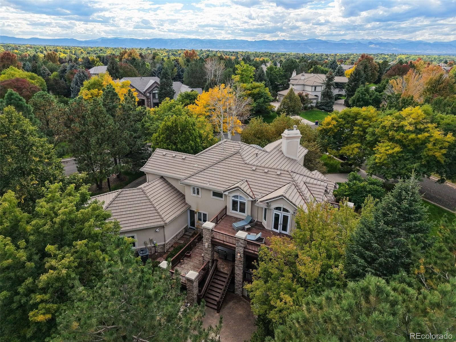 Tucked away on a quiet corner lot, this home offers a rare combination of recent renovations, exceptional privacy, and one of the largest yards in The Preserve. The home features a sun filled, open floor plan with expansive windows and fantastic flow throughout the main level. The chef’s kitchen showcases Wolf and Sub Zero appliances, generous prep space, and seamless connectivity to multiple covered patios that are perfect for year round indoor and outdoor entertaining. The oversized backyard delivers remarkable flexibility, whether envisioned as a private lawn retreat, garden sanctuary, or pool centric outdoor oasis. Upstairs, the primary suite serves as a serene escape, complete with a spa inspired bath, walk-in closet, and peaceful separation from secondary bedrooms. Additional upper level rooms offer versatility for family, guests, or home office needs. The fully finished lower level further expands the home, featuring a fitness studio, guest accommodations with an en suite bathroom and space ideal for a media room or recreation area. Set within the heart of Greenwood Village, residents enjoy top rated Littleton schools, convenient access to DTC and Cherry Creek, and exclusive Preserve amenities including a private rec center with pool, tennis courts, trails, and surrounding open space.