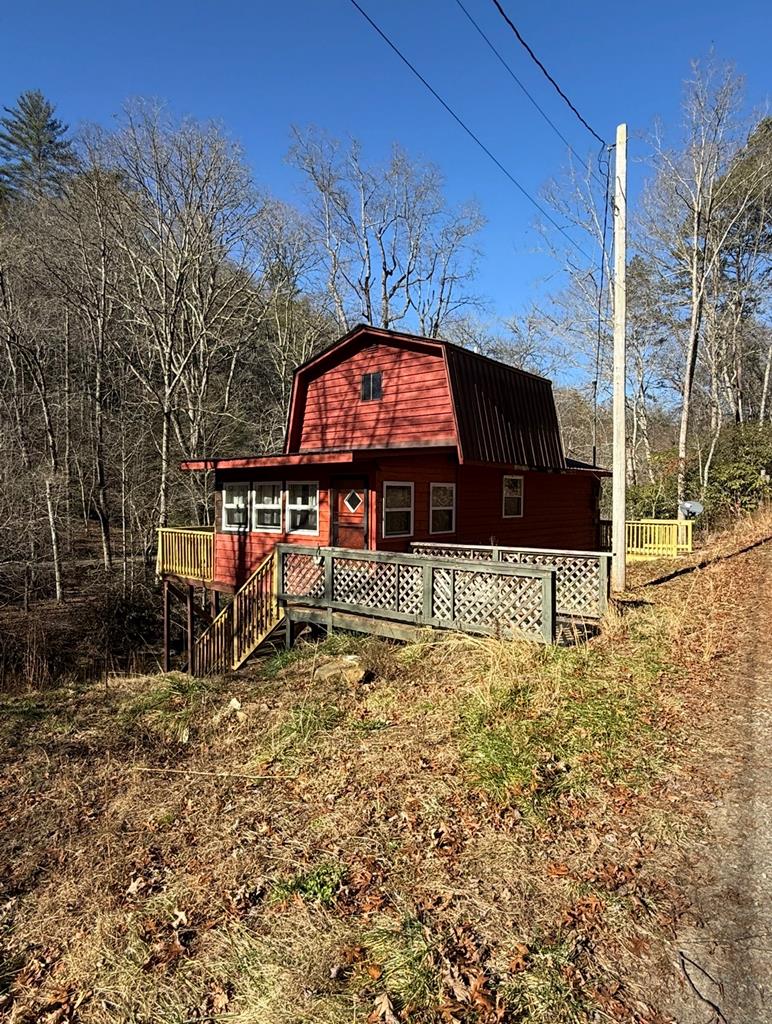 Your mountain getaway awaits! This easily accessible retreat features a new metal roof, a beautiful creek, and a recently updated septic system, offering comfort and peace of mind. Surrounded by the natural beauty of the mountains, this property provides everything you need to relax and feel right at home. Whether you're looking for a weekend escape, vacation rental, or full-time retreat, this is a must-see—schedule your showing today!