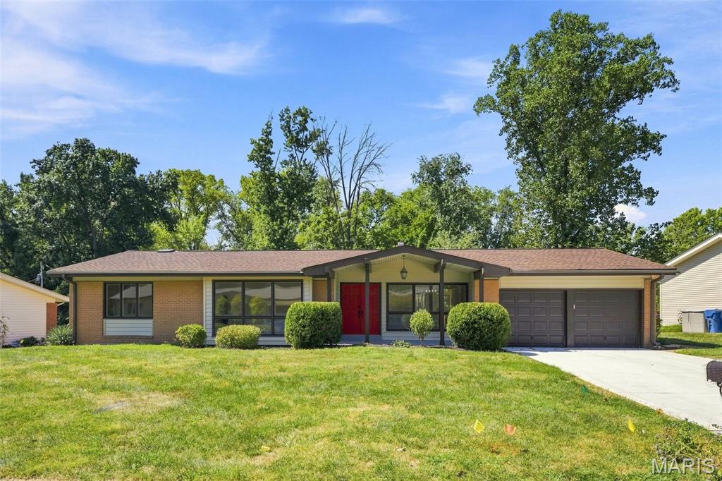 Welcome to a completely transformed Creve Coeur home where modern design, natural light, and thoughtful living spaces come together on over a half-acre! From the moment you step inside this large ranch home, you'll notice the contemporary feel and beautiful hardwood floors carried throughout the main level. The heart of the home is the stunning living space, anchored by a beautiful fireplace and an incredible wall of windows that brings the outdoors in and fills the room with natural light.The beautifully updated kitchen is designed to impress with sleek quartz countertops, a gas range, and a fresh modern aesthetic which makes everyday living and entertaining effortless. Just beyond the living spaces, is a large deck that overlooks a level backyard, creating the perfect setting for a pool, a playground for the kids, morning coffee, or gathering with friends.The main level offers 3 bedrooms and 2 full bathrooms, including a comfortable primary suite. Head downstairs to discover an incredible finished walkout lower level that feels like an extension of the main home. Two additional bedrooms and a full bathroom provide flexibility for guests, family, or multi-generational living, while the enormous recreational space offers endless possibilities for entertaining, movie nights, game days, or creating the ultimate home office or flex space.Every inch of this home has been thoughtfully updated, giving you the rare opportunity to enjoy a truly move-in-ready home without the projects. This Creve Coeur home delivers the space and style you've been waiting for - fresh, modern, completely updated, and ready for you to call home!