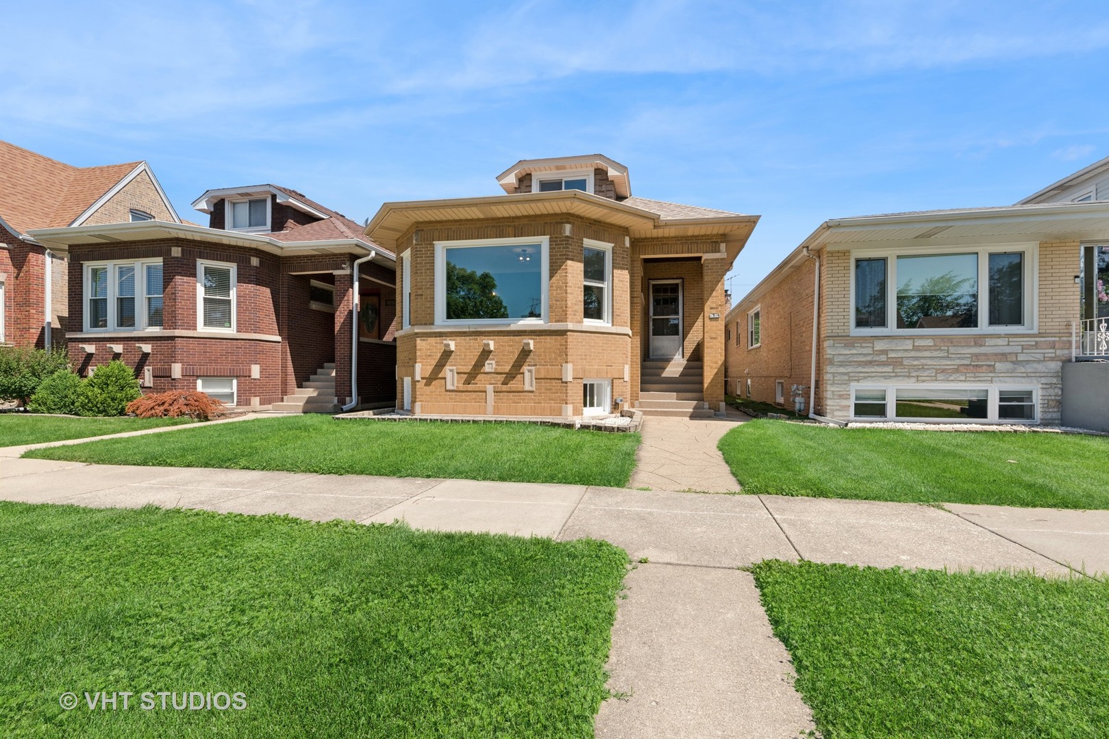 Beautiful Yellow Brick Bungalow!  Home is bathed in natural light in every room. Chicago's desirable Dunning neighborhood on a great tree-lined street. Living room and formal dining room perfect for family gatherings! It is a beautiful, updated & spacious 5 bedrooms, 2 full remodeled bathrooms- one on the first floor, one in the basement. Located on a beautiful tree- lined street. Come spread out on 3 finished floors. Owner has  thoughtfully upgraded for a move in condition home! Modern kitchen with new white shaker cabinets, brand-new appliances and room for breakfast bar/counter.. Extra large back porch leads to a nice sized yard and 2 car garage. The second floor can be a master suite with its own living room or have two additional  nice sized bedrooms. Just west of Portage Park/ east of Schorsch village in the Dunning area  It is a MUST SEE with a lot of new  features. ! Close to parks, transportation, schools, shopping etc.