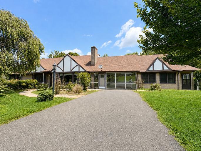 GREAT INVESTMENT PROPERTY!!  This 6 bedroom/ 4 full bath home spanning 4,100 sq. ft. of living area including 3 units that could be used for rental income!  The main house features a living room w/stone fireplace, formal dining room, large kitchen, 4 bedrooms, full bath, nice sunroom and large deck.  Upstairs you will find a generous bonus room and the basement is partially finished boasting an additional full bath and room currently used as a 7th bedroom.  Hardwood & tile floors, heat pump for heat & air, public water, private septic system and natural gas hookup.  The main level apartment has a living area, kitchen, bedroom, full bath, laundry and enclosed side porch and the lower level apartment which is currently rented has a living area, large kitchen, full bath and partitioned bedroom.  Home sits on a nice 2.75 (+-) acre lot within the town limits of Hillsville making it within walking distance to downtown shopping & restaurants and only minutes from I-77!  There are two outbuildings and the property is zoned R2.