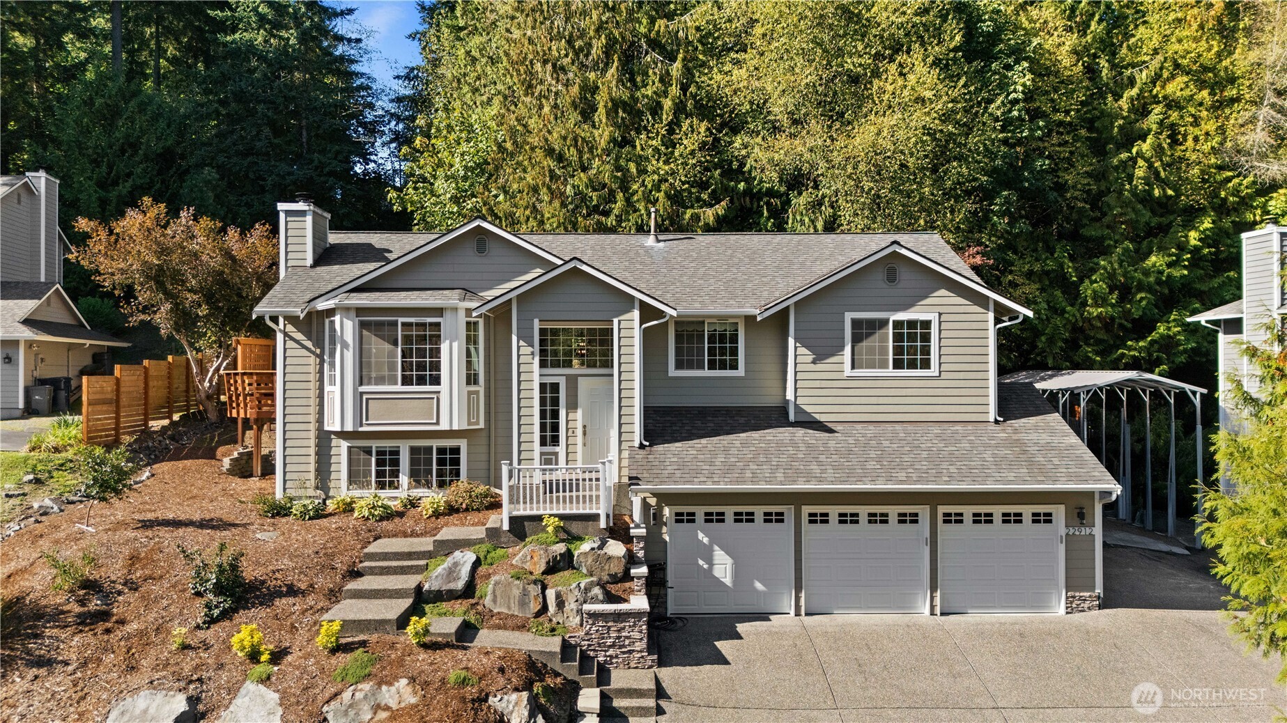 Set on a quiet cul-de-sac with a greenbelt in front and lush greenery behind, this updated east-facing 4BD/2.75BA home offers style, space, and privacy. The sunlit main level features open living/dining with a fireplace and a remodeled kitchen with stainless appliances and a casual dining peninsula. The primary suite includes a walk-in closet and spa-like bath, with two more bedrooms and a full bath nearby. Downstairs offers a spacious bonus room, 4th bedroom, and full bath—perfect for guests, office, or gym. Enjoy summer BBQs or relax in the hot tub on cool evenings. Includes wired generator, 3-car garage, and a prime location near Brier Elementary, parks, and future light rail.