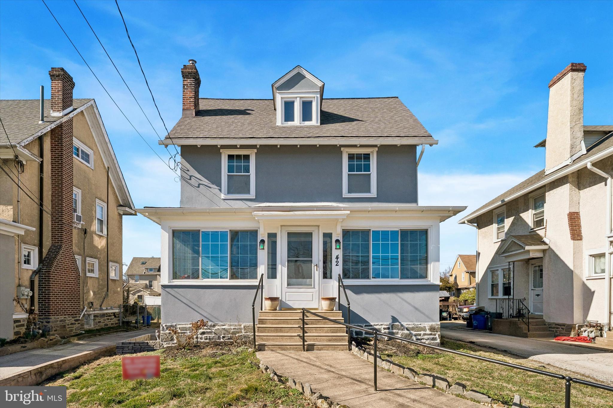 Welcome to 42 Brookline Blvd! Character and charm are found throughout this thoughtfully updated home in the heart of Havertown. Just steps from local shops, restaurants, and public transportation, this home is a must-see for anyone seeking a walkable lifestyle. Enter through the bright Sunroom and immediately notice the beautiful hardwood flooring that extends throughout the first floor, along with charming architectural details. The Living Room features a cozy gas fireplace and crown molding and flows into a versatile center Sitting Room that provides access to the Powder Room, laundry room with sliding barn door, and a convenient side entrance. The formal Dining Room, highlighted by a bay window and elegant moldings, offers the perfect setting for both entertaining and everyday meals. The updated Kitchen is a chef’s dream with abundant counter space, ample cabinetry, and stainless steel appliances. A bright Breakfast room, with a ceiling fan and access to the unique two-sided center staircase, completes the main level. The second floor features a spacious Primary Suite with generous closet space, a Sitting Room, Bonus Room, and a Full Bathroom with a stall shower. Two additional sizable Bedrooms are also found on this level, one featuring a decorative fireplace and built-ins, along with a large Full Hall Bathroom with a tub/shower combination. The third floor offers a fantastic Flex Space with vaulted ceilings, along with a fourth Bedroom and Full Bathroom with a stall shower. Additional storage can be found in the unfinished Basement and the detached two-car garage with Loft space. If you’re searching for a home that blends thoughtful updates (HVAC, Roof, Kitchen, Etc.) with original character, in a highly walkable Havertown location, look no further than 42 Brookline Blvd.