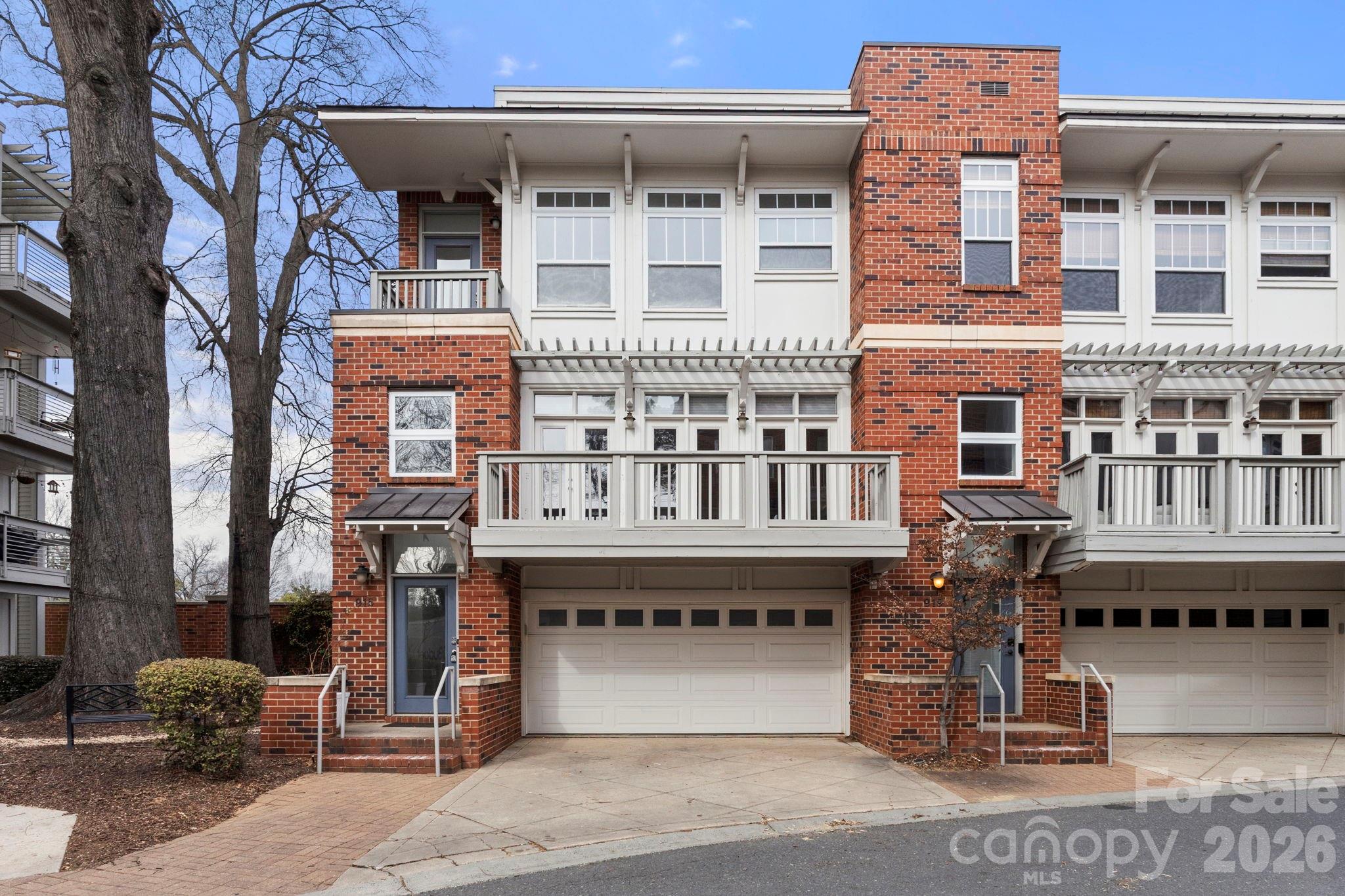 Stunning modern entry leads to a light-filled open floorplan designed for both everyday living and elevated entertaining. This beautifully appointed 3-bedroom, 2.5-bath condo blends thoughtful design with stylish finishes throughout — plus fresh interior paint, brand-new carpet in the bedrooms, and a new front deck for a truly move-in-ready experience.The kitchen features granite countertops, tons of cabinetry, split-face tiled backsplash, stainless steel appliances, and a wet bar area. Modern light fixtures, a built-in sound system, multiple balconies, a unique city view, and abundant natural light elevate the entire living experience.Upstairs, the primary suite offers a spacious retreat complete with a walk-in closet and private bath. Two additional bedrooms provide flexibility for guests, office space, or whatever suits your lifestyle — all enhanced with new carpet for added comfort.The must-see oversized garage impresses with exceptional space and versatility — ideal for storage, a home gym setup, workshop area, or maybe a tailgate-prep zone.Enjoy the unbeatable Elizabeth location — just moments from dining, shopping, and entertainment — walking distance to Independence Park and the Lynx Gold Line, plus quick access to Uptown, Plaza Midwood, and nearby hospitals. Convenience and connectivity truly set this home apart.This exceptional end unit delivers style, space, and accessibility in one of Charlotte’s most vibrant areas.