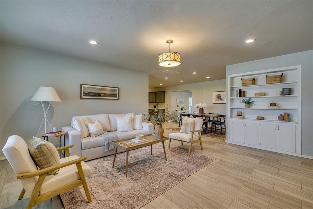 Welcome to 1501 Carlton Way! This beautifully updated 3-bedroom, 2-bathroom home offers 1,931 square feet of inviting living space with an incredible layout designed for entertaining, relaxing, and making memories. One of the standout features is the true second living room or oversized bonus room, making it the perfect spot for cozy fall nights, movie marathons, game days, or gathering with friends and family!The home features multiple living and dining areas, an updated kitchen with granite countertops, stainless steel appliances, and a center island, plus plenty of space to spread out and make yourself at home. With so many updates throughout, this home is truly move-in ready! A new Class 4 impact-resistant roof adds even more value and peace of mind. Situated on a spacious corner lot, the property also offers a generous backyard, covered patio, and two-car garage. Conveniently located near Lake Hefner, shopping, dining, parks, and major highways, this home combines comfort, functionality, and a fantastic location. With room to entertain, space to unwind, and updates already taken care of, this is one you won't want to miss. Come see all that 1501 Carlton Way has to offer!