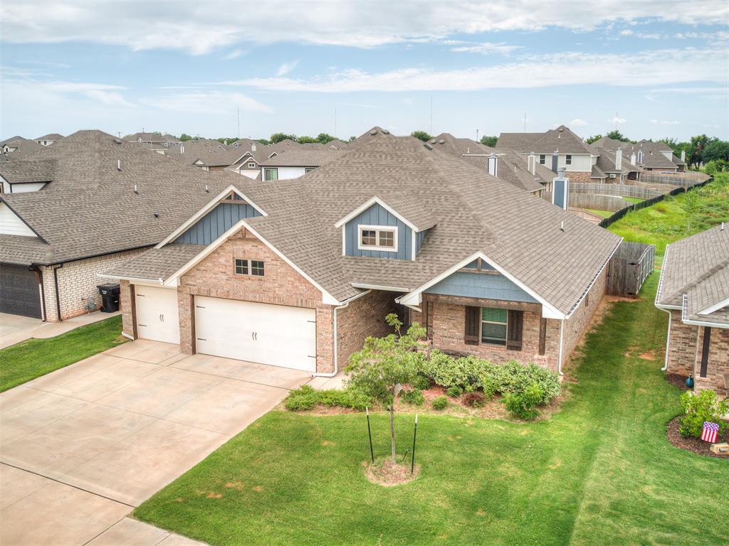 Stop looking....this is THE ONE!  1.5 miles from I-240 and 2.5 miles from I-35 give you lots of commuting options!    Located in the sought after The Waters addition in Moore!  This addition is full of PONDS and fun places to walk on the TRAILS!  The kiddos will love the PARK.  This gorgeous 4 bed, 2 bath, 3 car garage home is FLAWLESS!  The open concept kitchen and living room make family life and entertaining a breeze.  The primary suite is large with great natural light.  The primary bathroom includes a WALK-IN SHOWER and DEEP SOAKING TUB!  The PRIMARY CLOSET is HUGE and is connected to the laundry room!!!  The kitchen is gorgeous with STAINLESS APPLIANCES, a large island, and large pantry!  The living room has a great FIREPLACE and is completed with an wood ceiling beam!  The secondary bath and bedrooms are a great size and all boast closets with double doors.  The back patio is so inviting and a perfect place to start your day with a cup of coffee! The OUTDOOR FIREPLACE makes chilly nights with a glass of wine comfortable and fun!  There is a VIEW OF THE WETLANDS that will never have a home built there!  All appliances included with acceptable offer!  Schedule a personal showing today!
