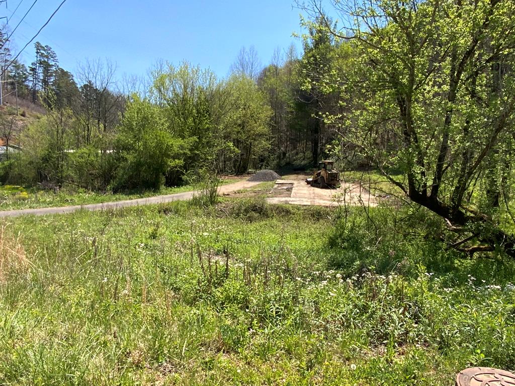 Exceptional downtown Murphy opportunity! This unrestricted 1-acre lot/land parcel—listed with strong commercial appeal—sits right in the heart of town and offers incredible flexibility for your vision. Zoned Heavy Industrial yet fully adaptable for residential use, the old building has been totally removed following the 2022 fire, leaving a clean, cleared site ready for its next chapter. The current owner is actively continuing to clean up the property and make improvements to make it even more turnkey. City water and sewer are already in place, mobile homes are allowed, and the location puts you steps from everything Murphy has to offer—perfect for new construction, storage facilities, commercial development, or building your dream home. Don't miss this rare blank canvas in the center of it all. Come see the potential today and make it yours!